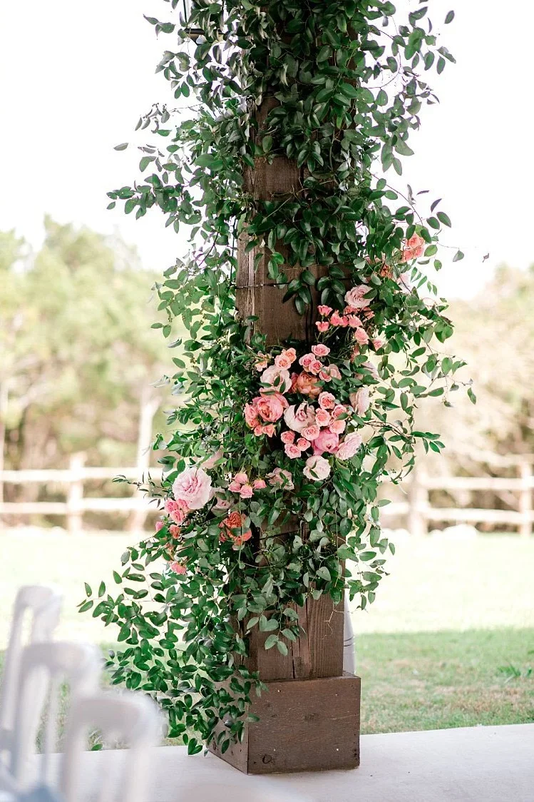 flower installation around wood post