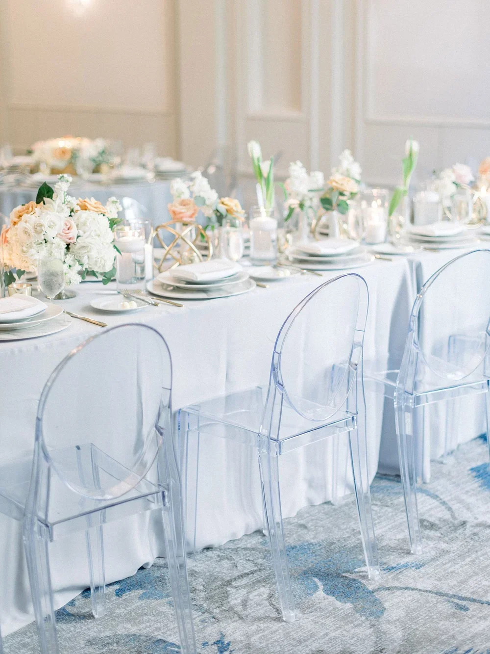 Grey linen and acrylic chair tablescape