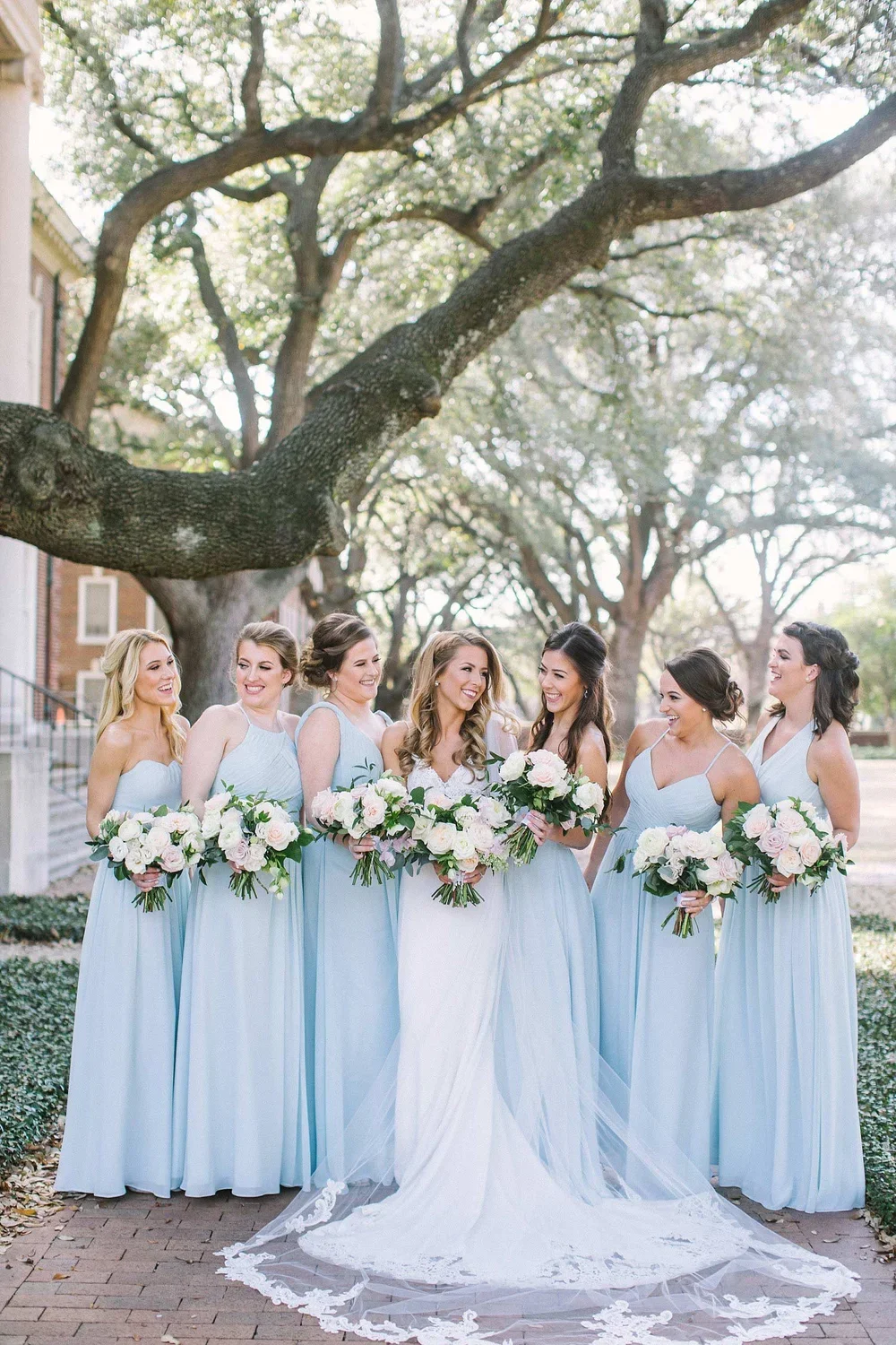 Bridesmaids in dusty blue long dresses