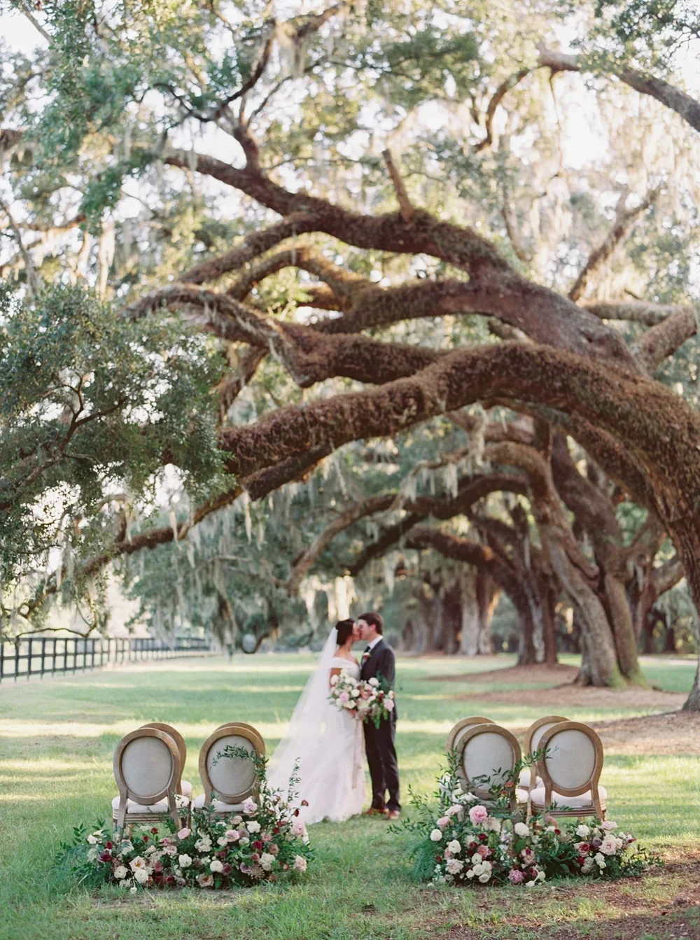 Bride and groom ceremony in front of Spanish Moss Trees in South Carolina Wedding