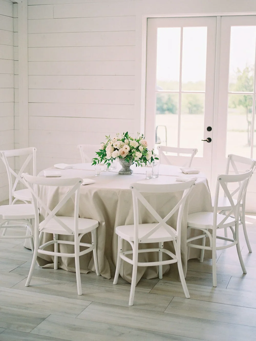 Neutral wedding reception at white barn