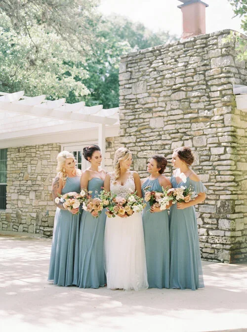 Bridesmaids in long sage green dresses at Addison Grove in Outdoor Texas Wedding