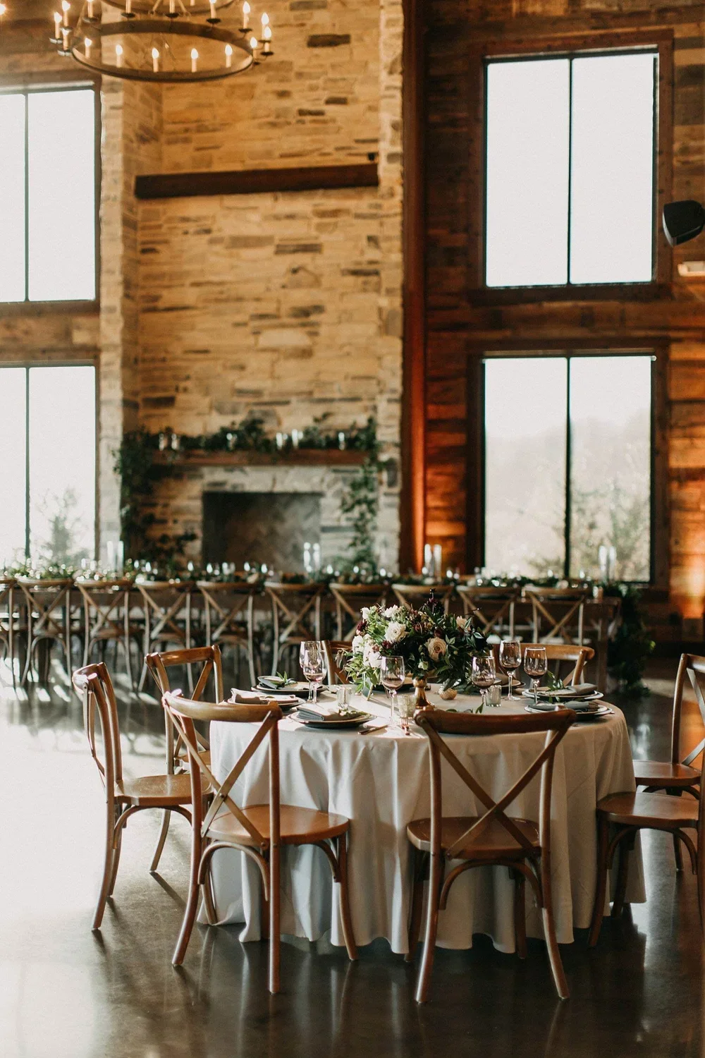 Rustic dallas wedding reception with a large stone fireplace