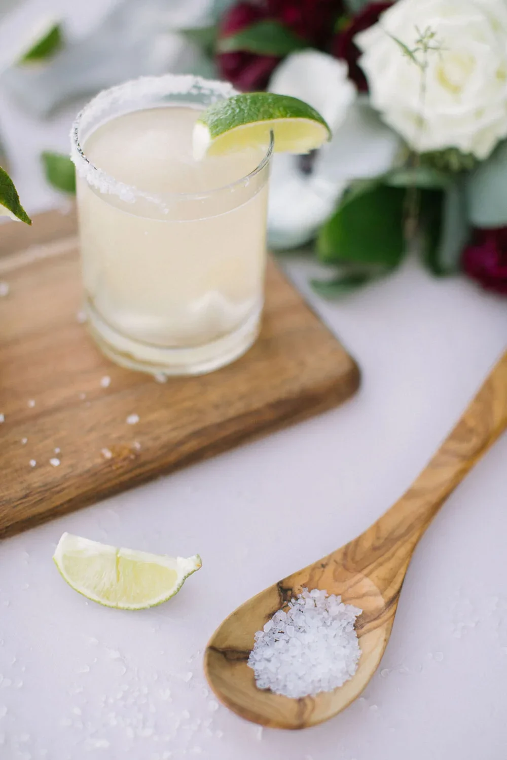 Margarita on a wood cutting board flat lay