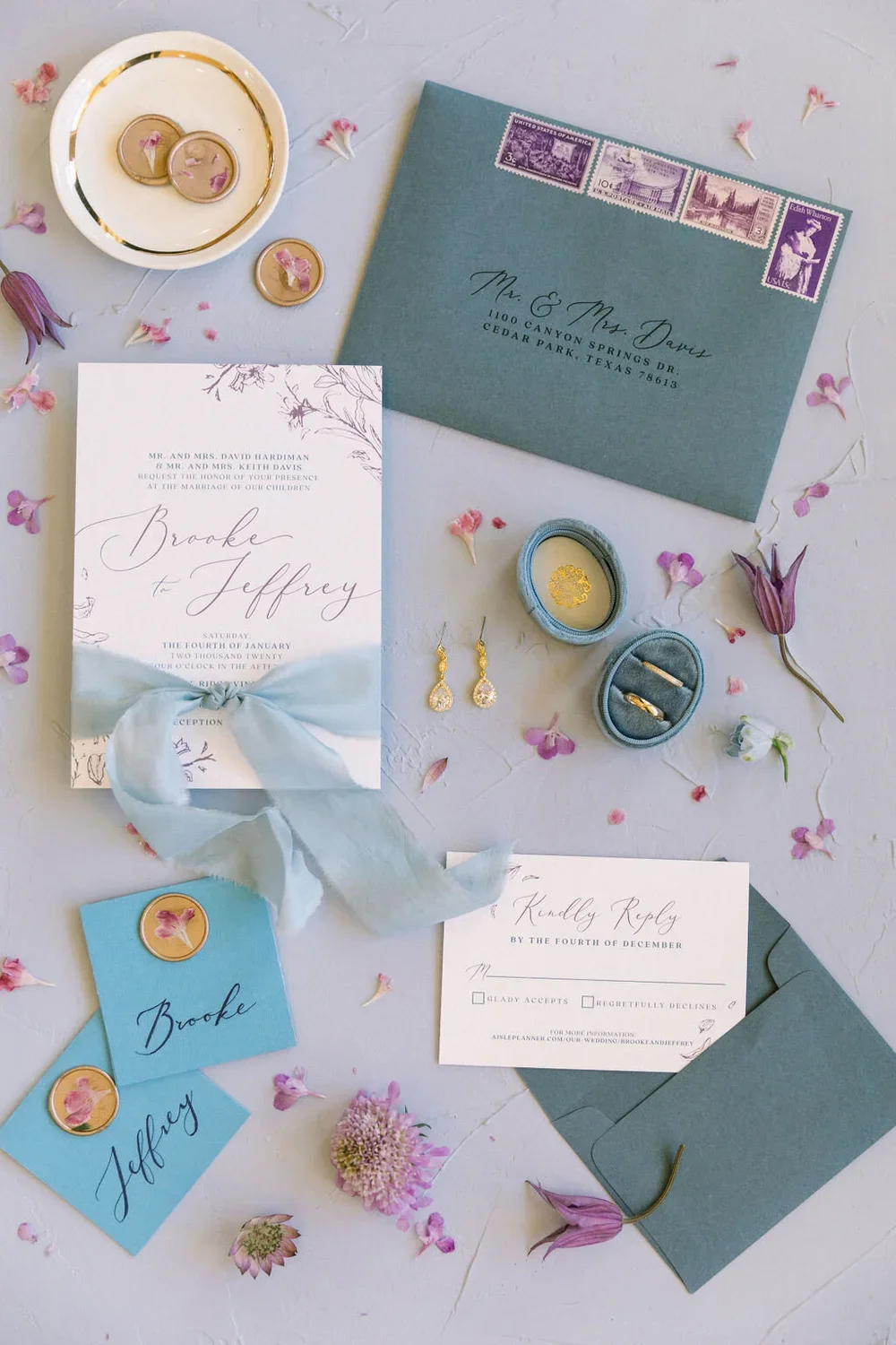 Blue envelope wedding invitations with white paper