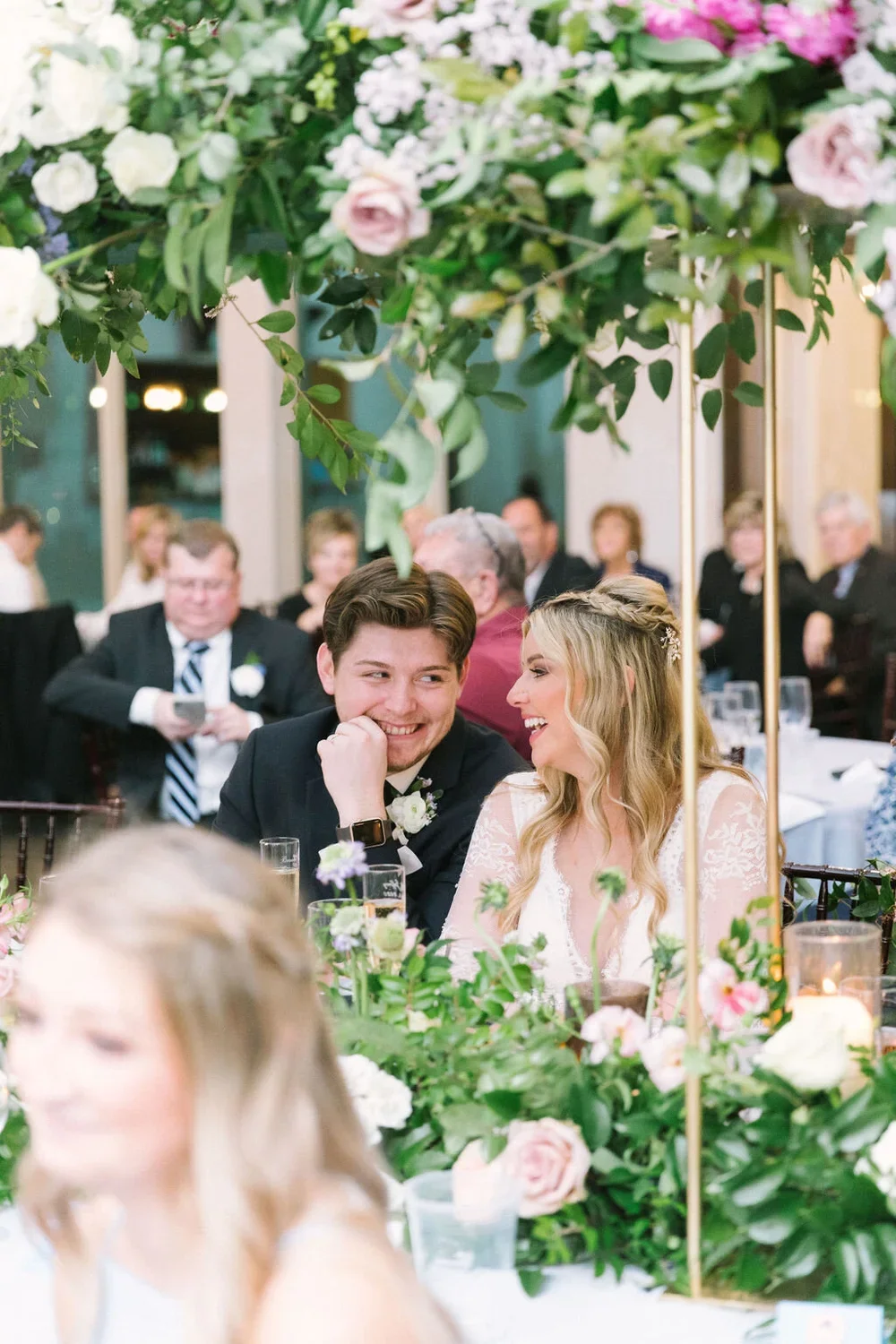 Couple under a flower garland at a Texas Wedding in Weatherford