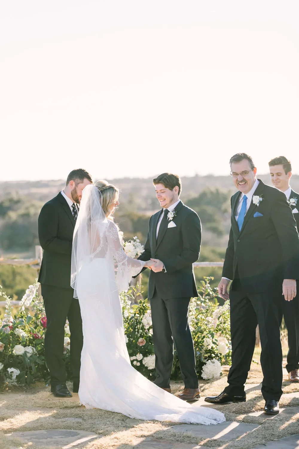 Bride &amp; groom during a ceremony in the Hill Country