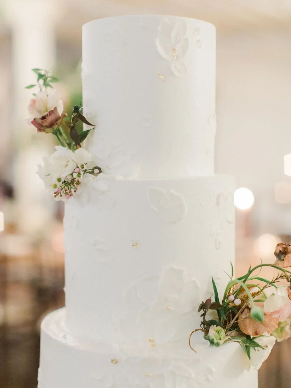 White cake with gold flake details