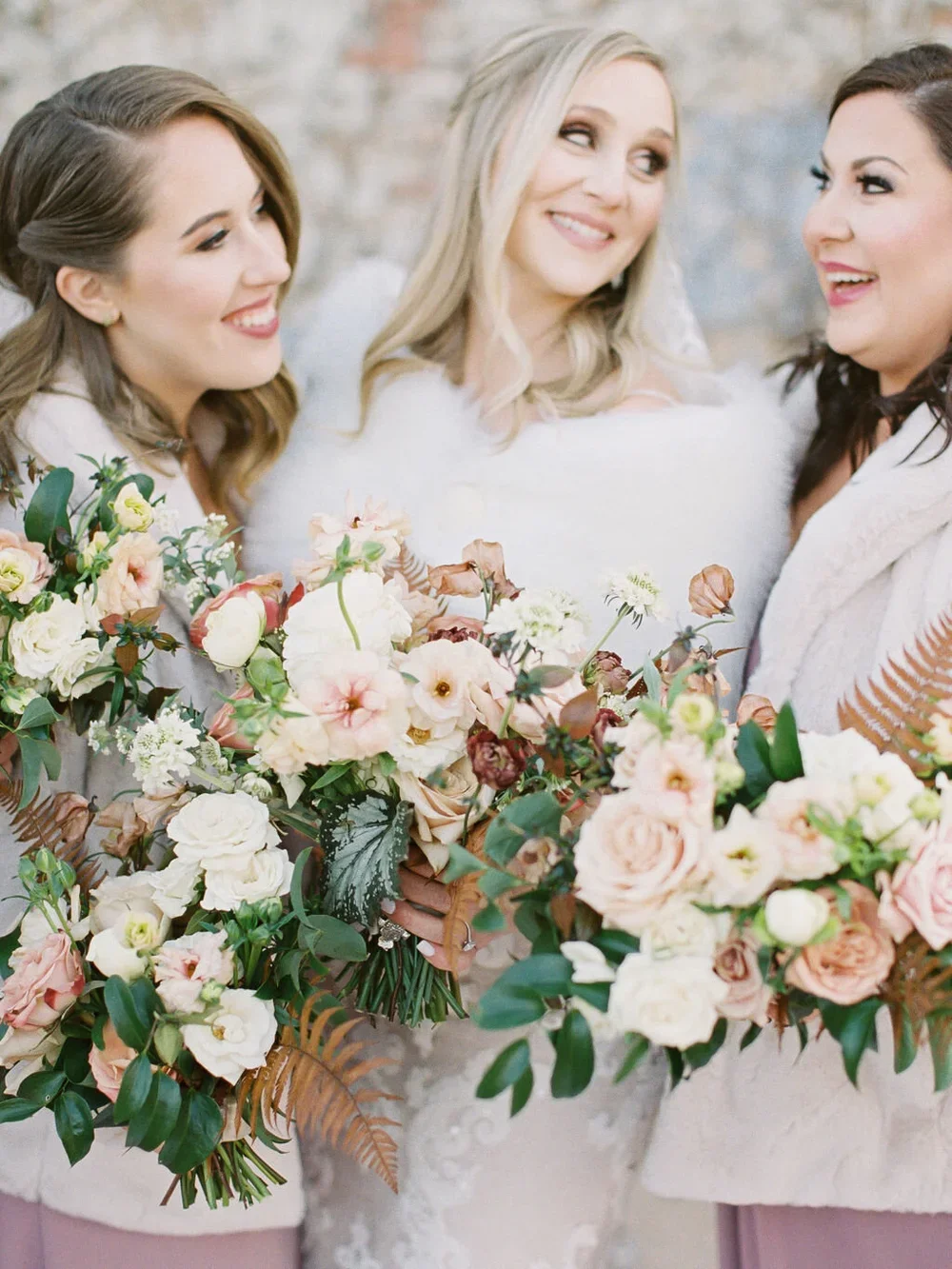 Orange, white &amp; peach bridesmaid bouquets