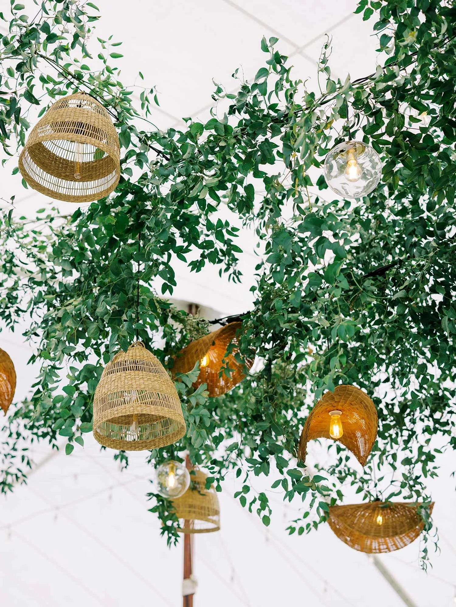 Dance floor installation with greenery and baskets