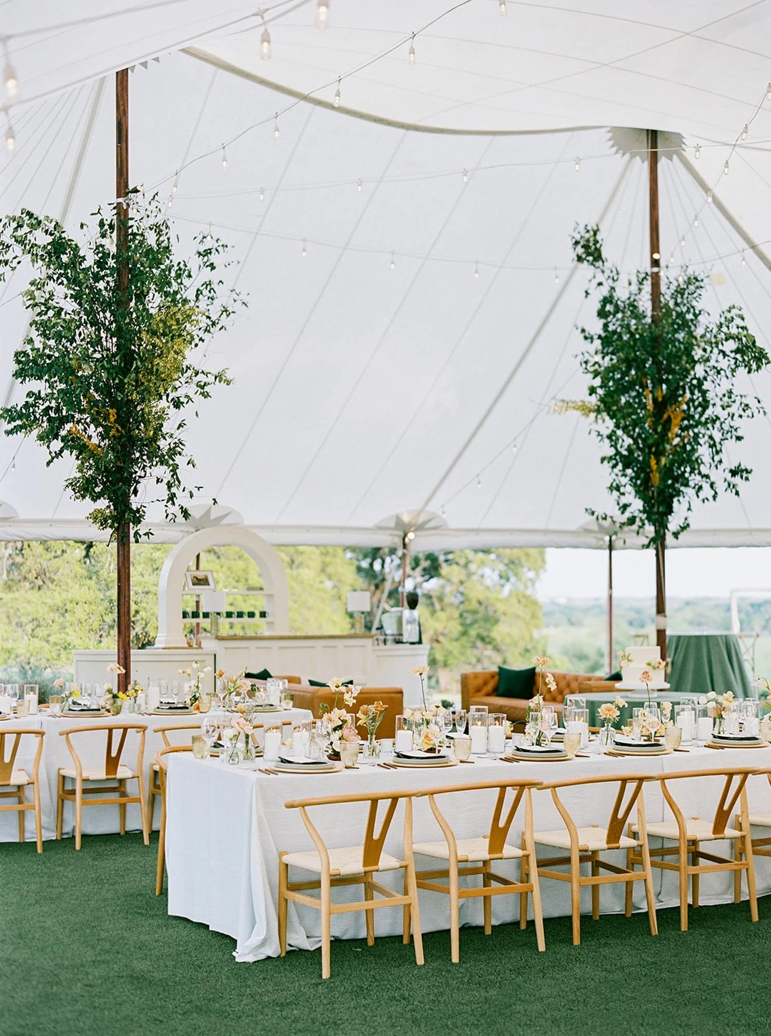 Sailcloth Tent trees on posts at tented wedding