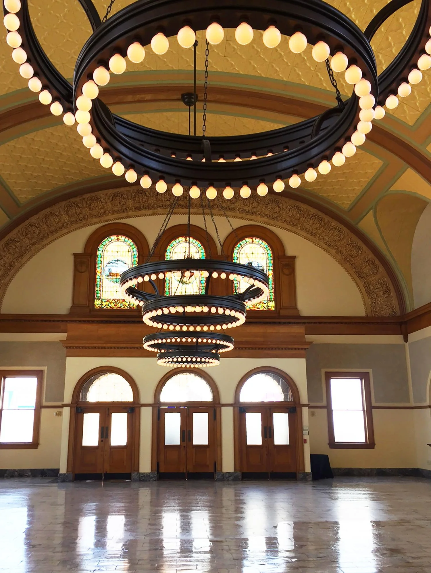 The Ashton Depot interior grand ballroom round chandeliers