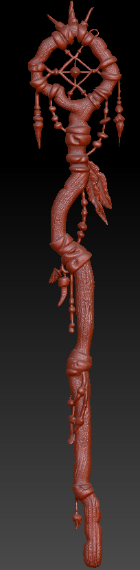 A detailed, ornate, wooden staff or scepter with intricate carvings and a circular top design, against a black background.