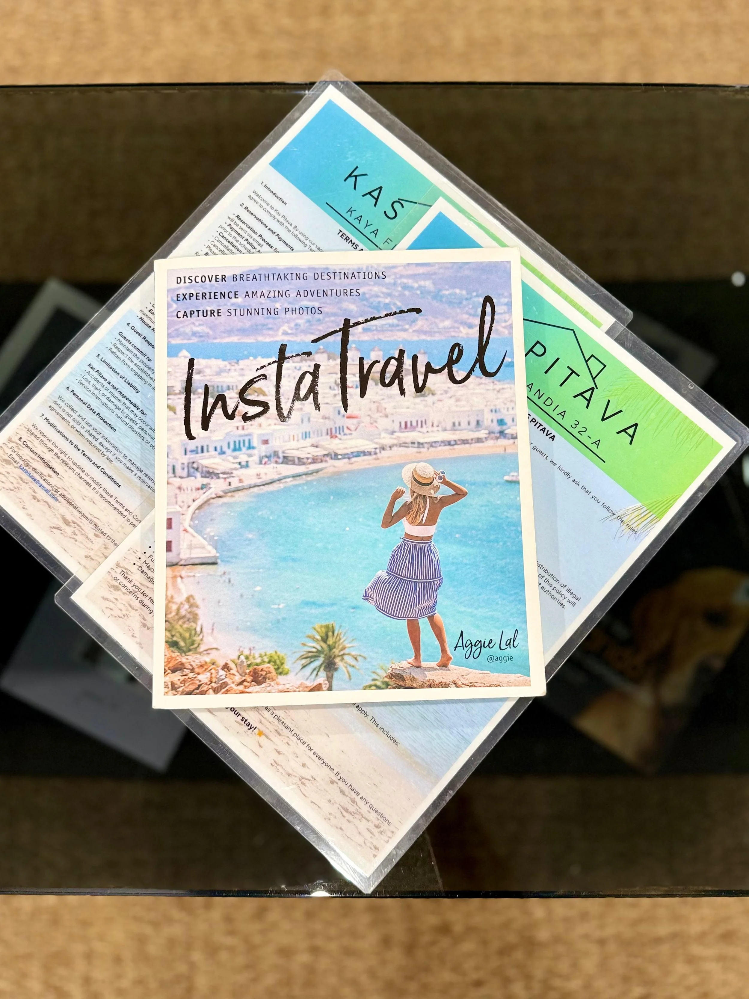 "InstaTravel" book at Kas Pitava – visual travel inspiration for curious explorers.
