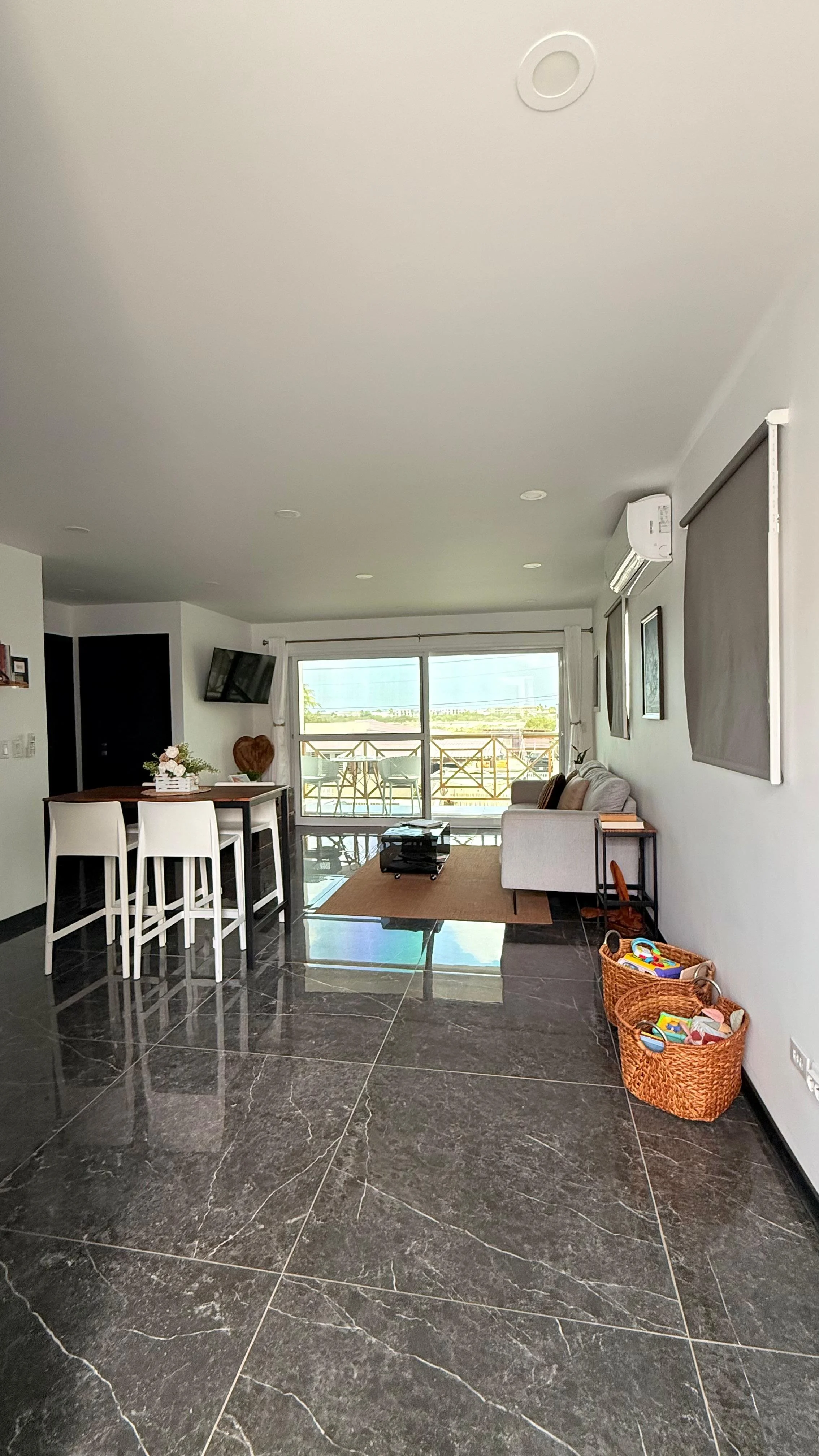 Open kitchen and dining area at Kas Pitava with breakfast bar and access to the balcone.
