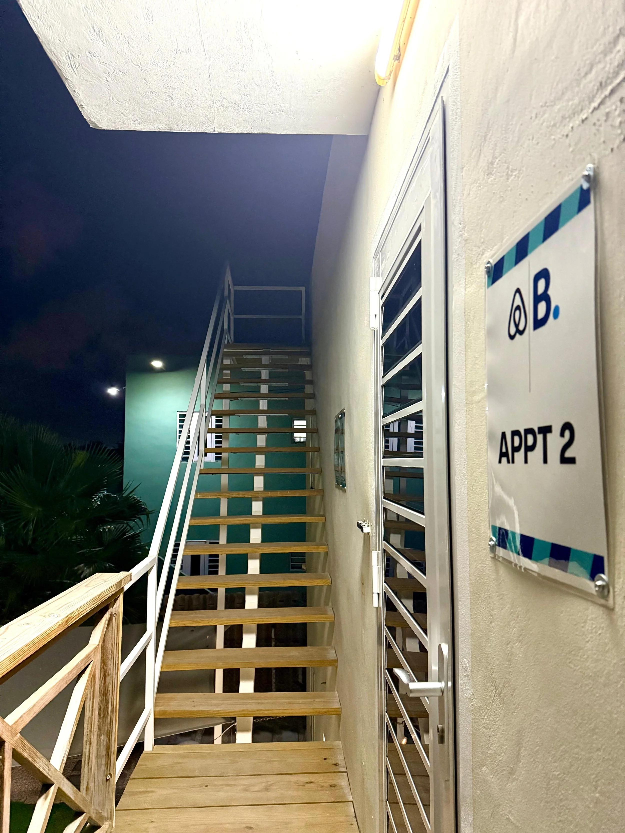Night staircase view of Kas Pitava with illuminated corridor