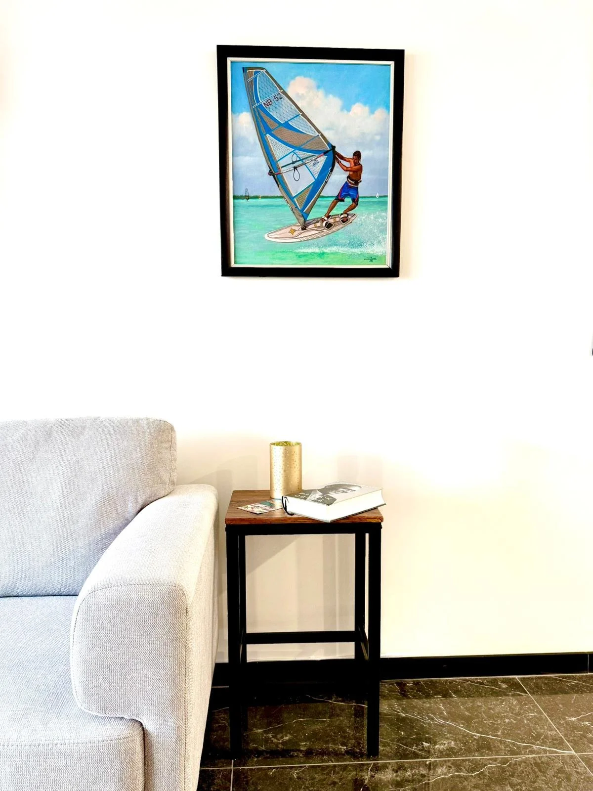 Colorful painting of a windsurfer in Bonaire, decorating the wall at Kas Pitava.