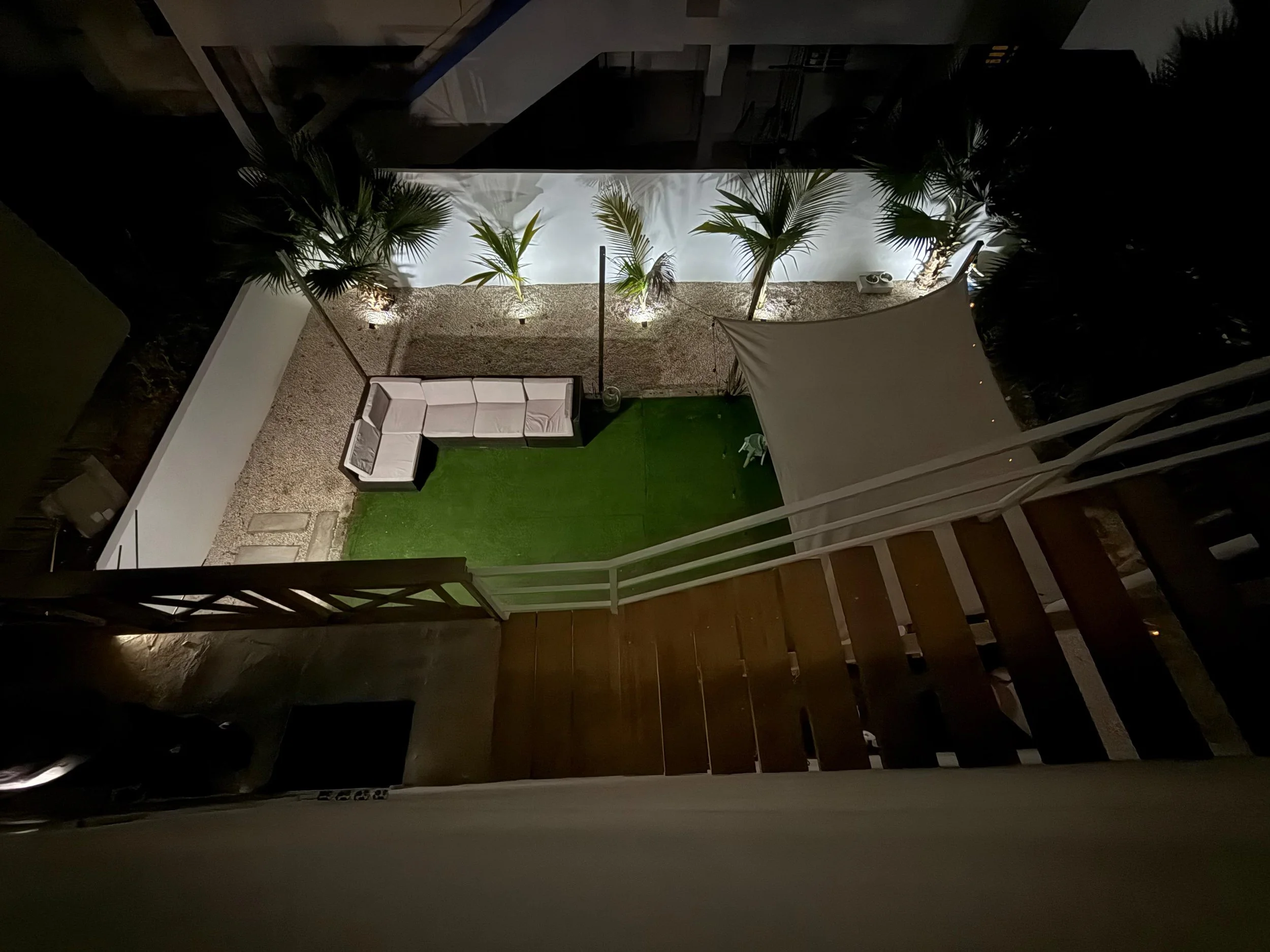 Top-down view of backyard from Kas Pitava rooftop terrace