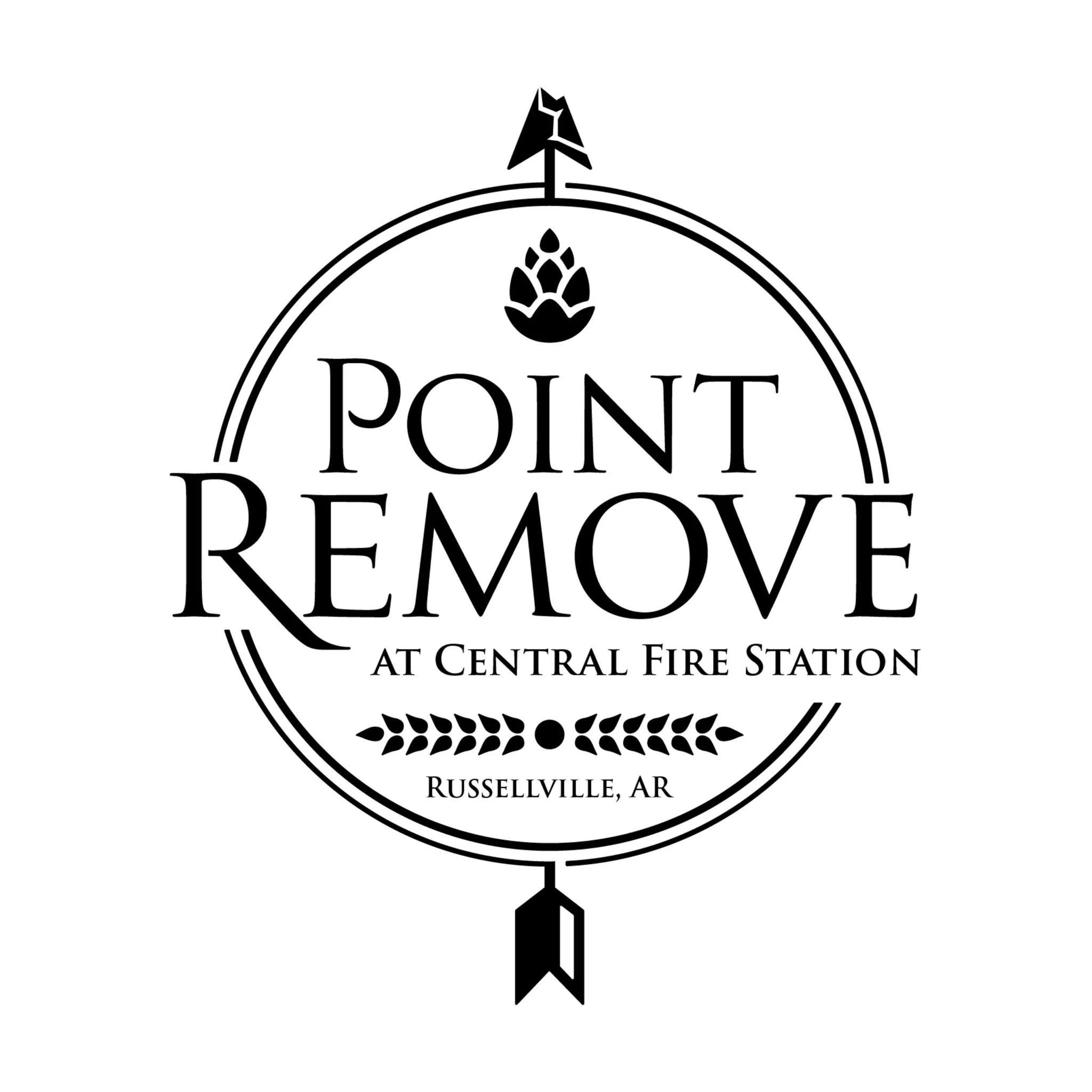 Sign for Point Remove at Central Fire Station in Russellville, Arkansas, featuring a circular design with arrows and decorative elements.