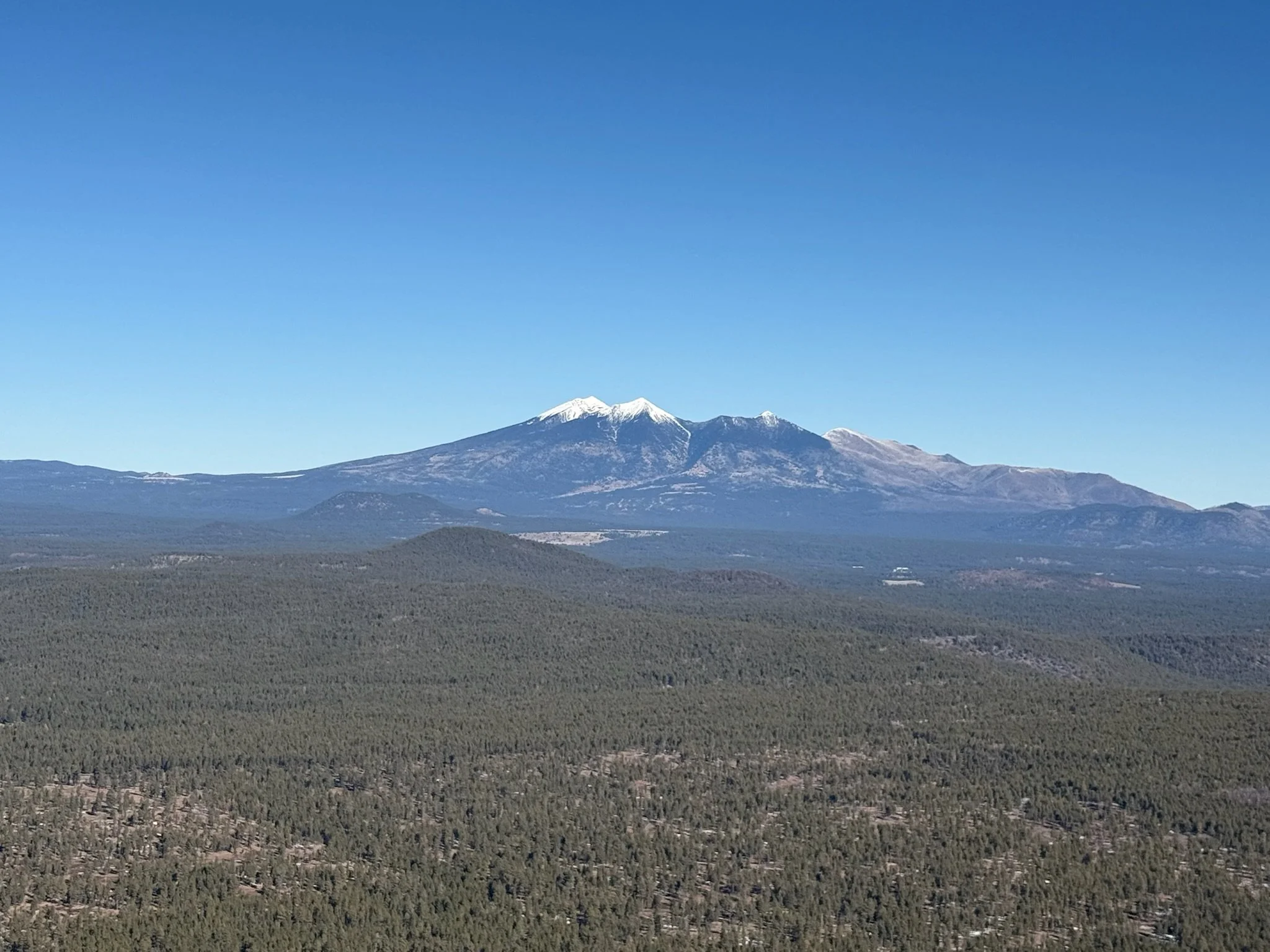 Aerial view of San Francisco Peaks from Sedona with Bluebird Air Tours