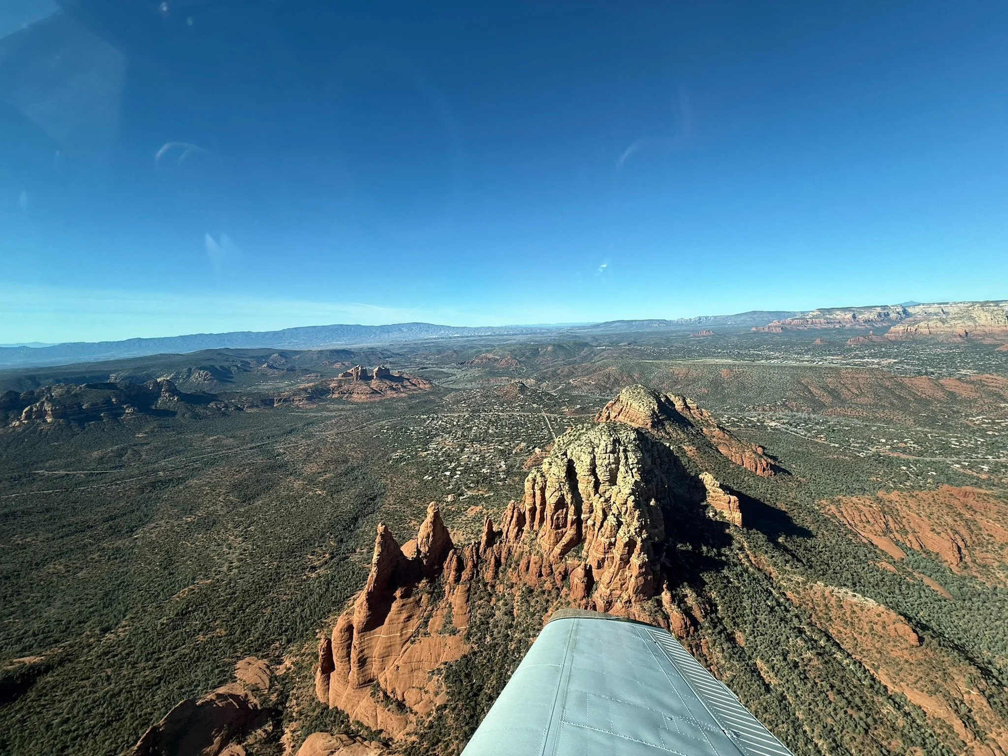 Bluebird Air Tours airplane flying over Sedona Arizona