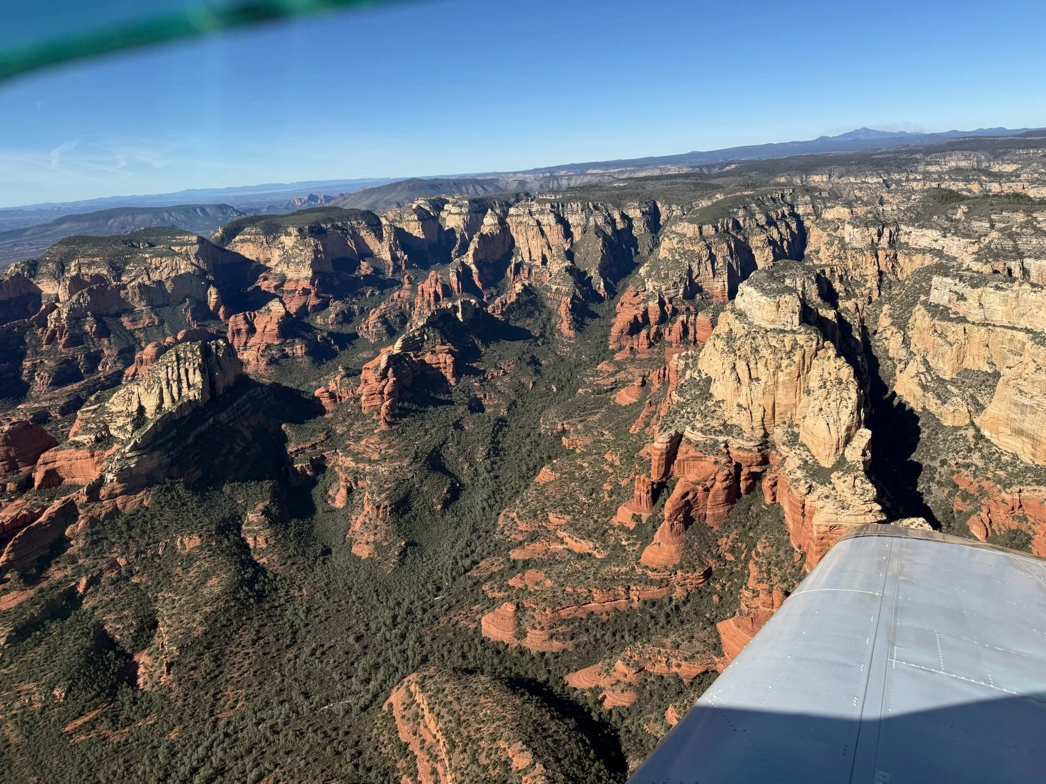 High altitude view of Sedona red rocks and surrounding valleys