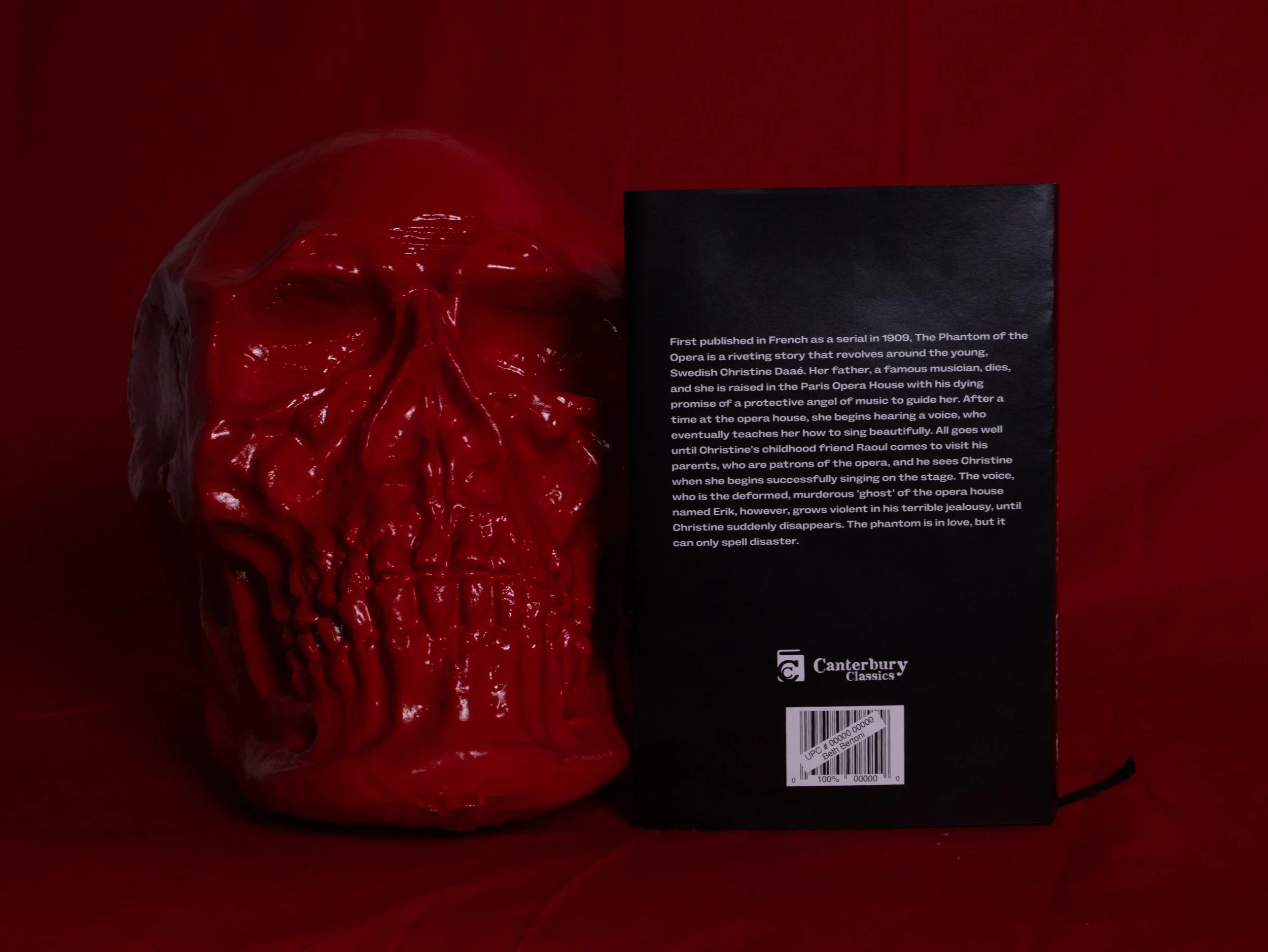 The skull sitting beside the back of the book