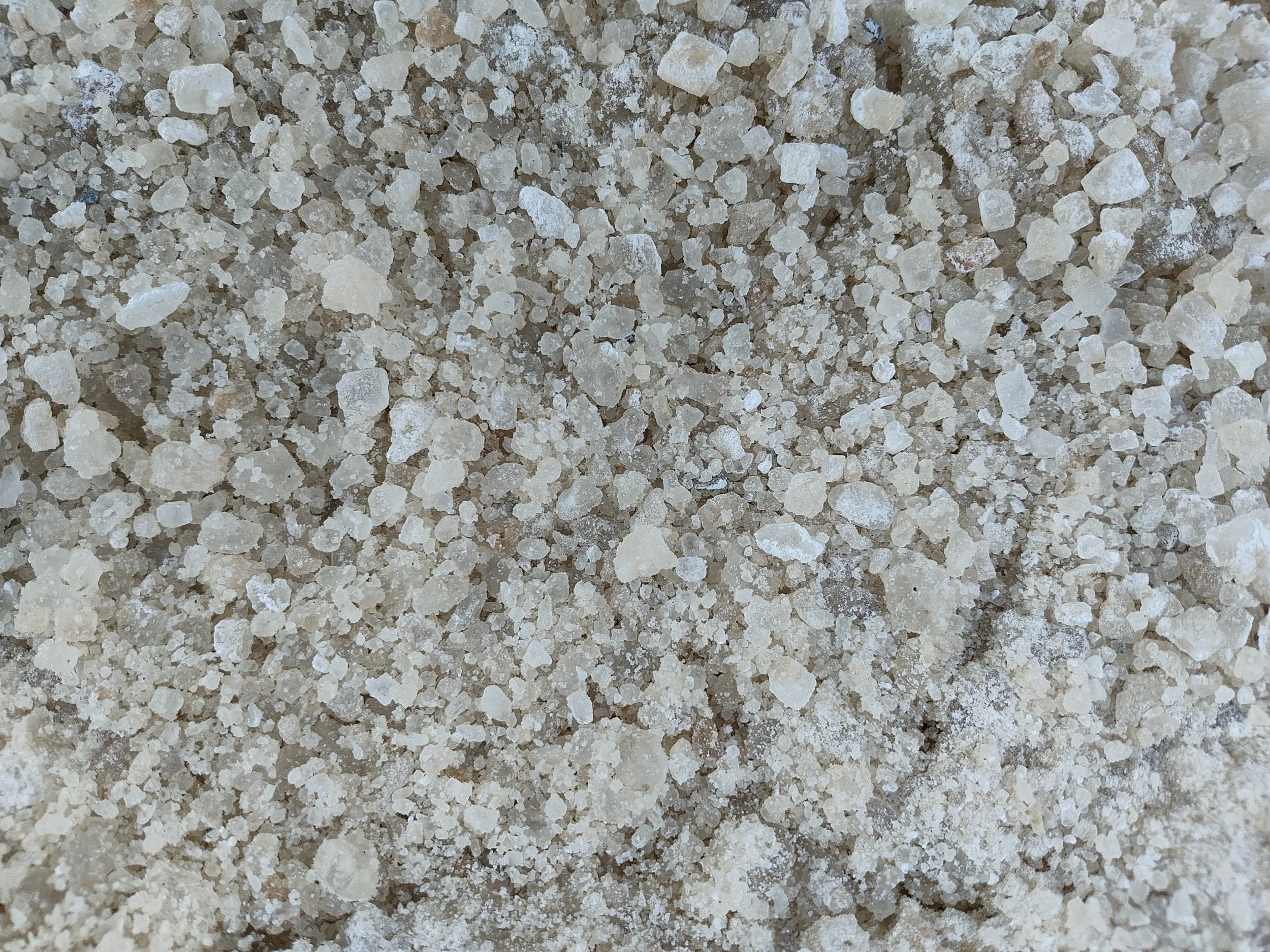 Bulk salt as applied to roads in snow and ice conditions.