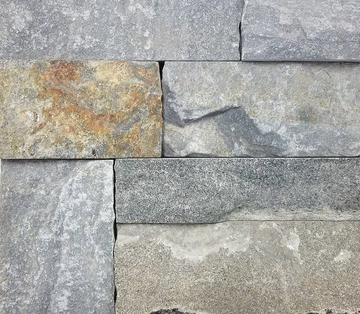 Natural stone veneer blend of bluish-gray and rusty brown tones in a 2-3-5 inch ledgestone configuration.