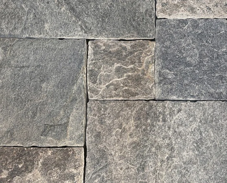 A natural stone ashlar veneer featuring warm gray tones with a hint of brown.