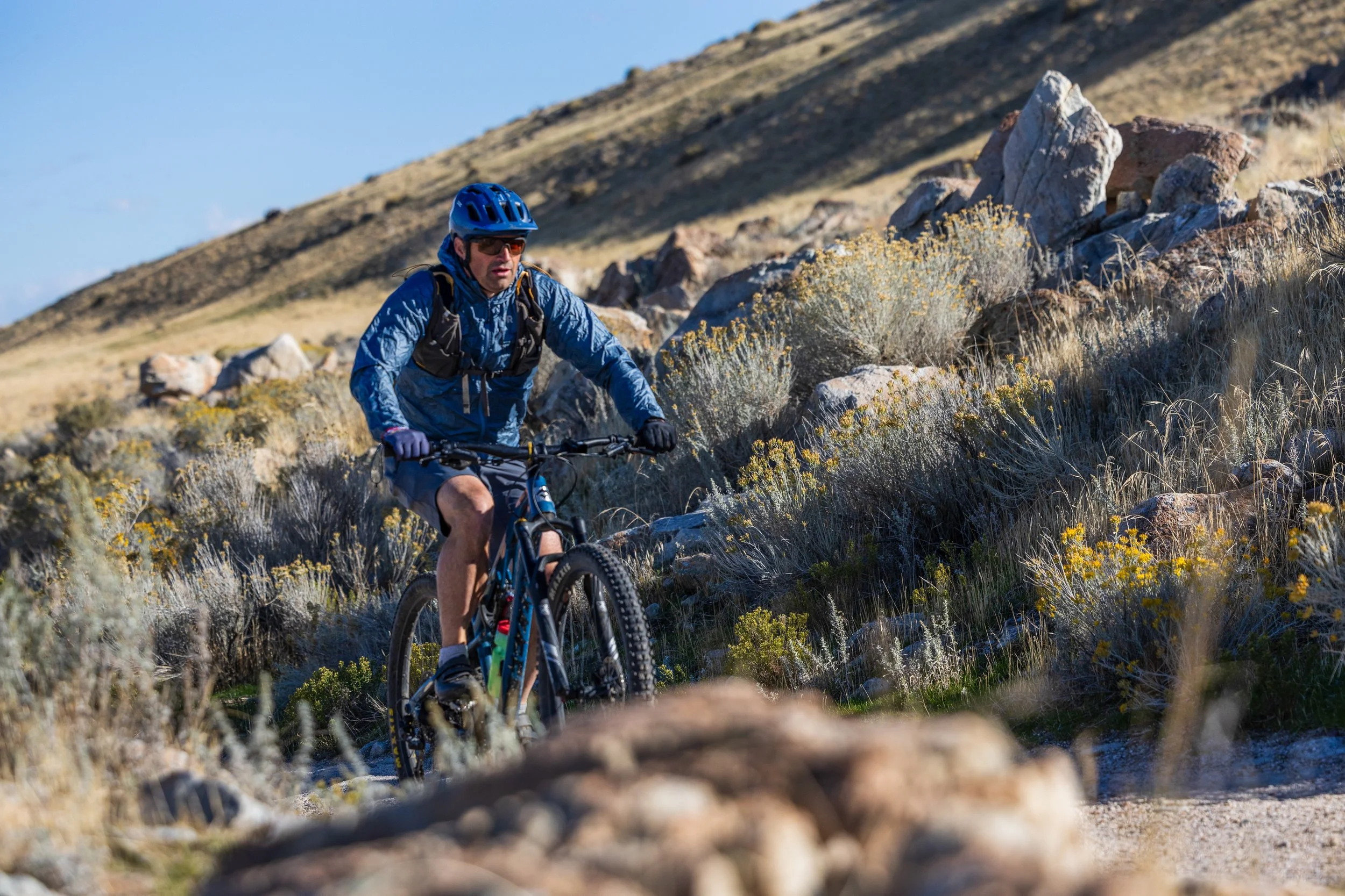 Valhalla Antelope Island mountain biker riding desert singletrack above the Great Salt Lake.