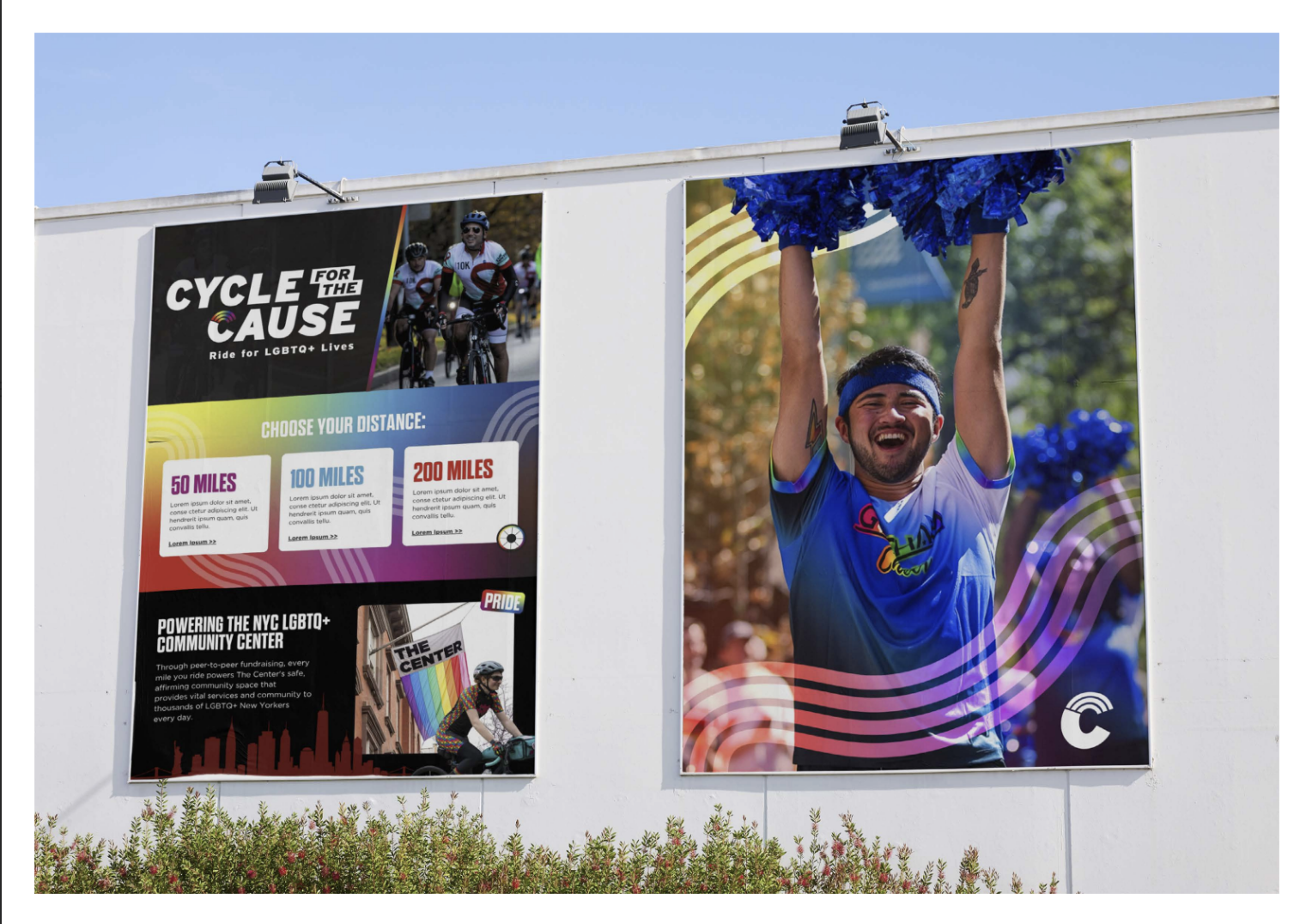 Two large posters on a white outdoor wall promoting a cycling event for LGBTQ+ Lives. The left poster features cyclists and information about different race distances with a rainbow theme. The right poster shows a smiling man in a blue shirt and head
