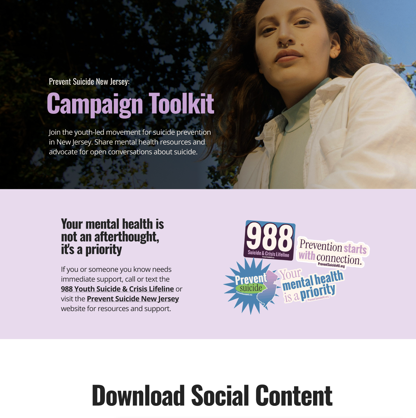 A young woman with long brown hair, light skin, and a septum piercing, wearing a white shirt, looks into the camera against a background of dark tree branches and a blue sky.