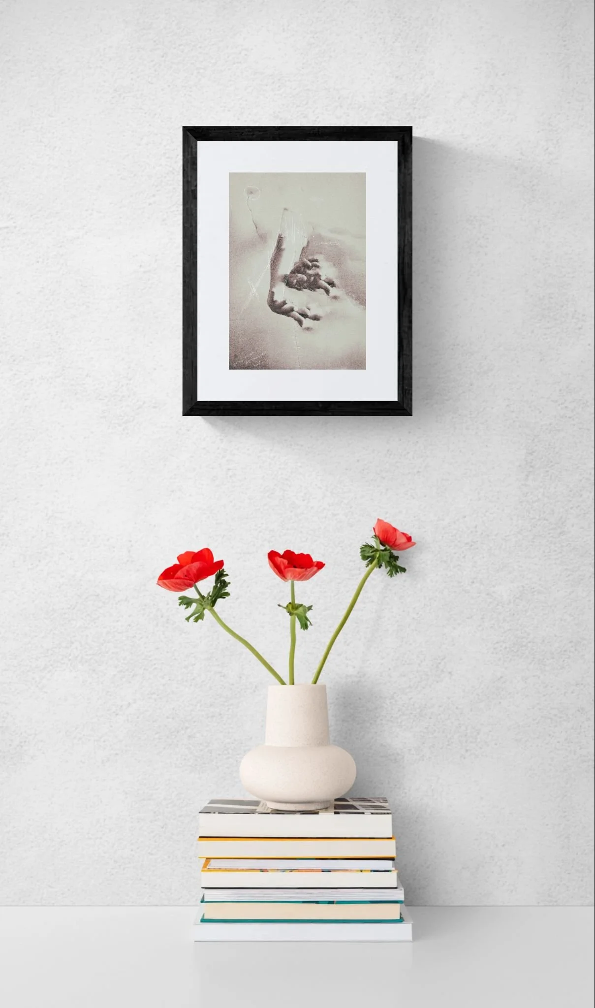 Red flowers in a vase sitting on books (3).jpeg