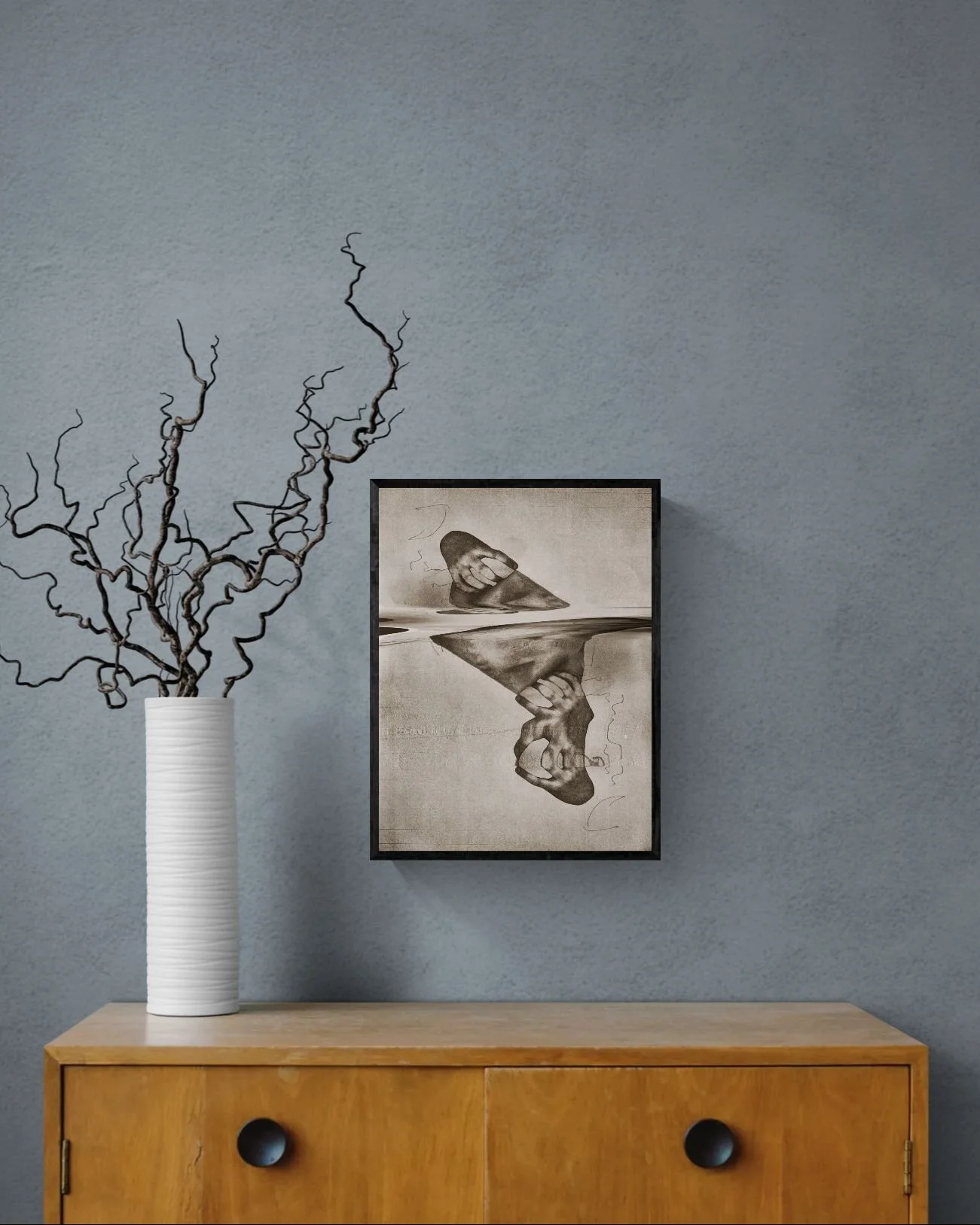 Curly twigs in vase sitting on cabinet.jpeg