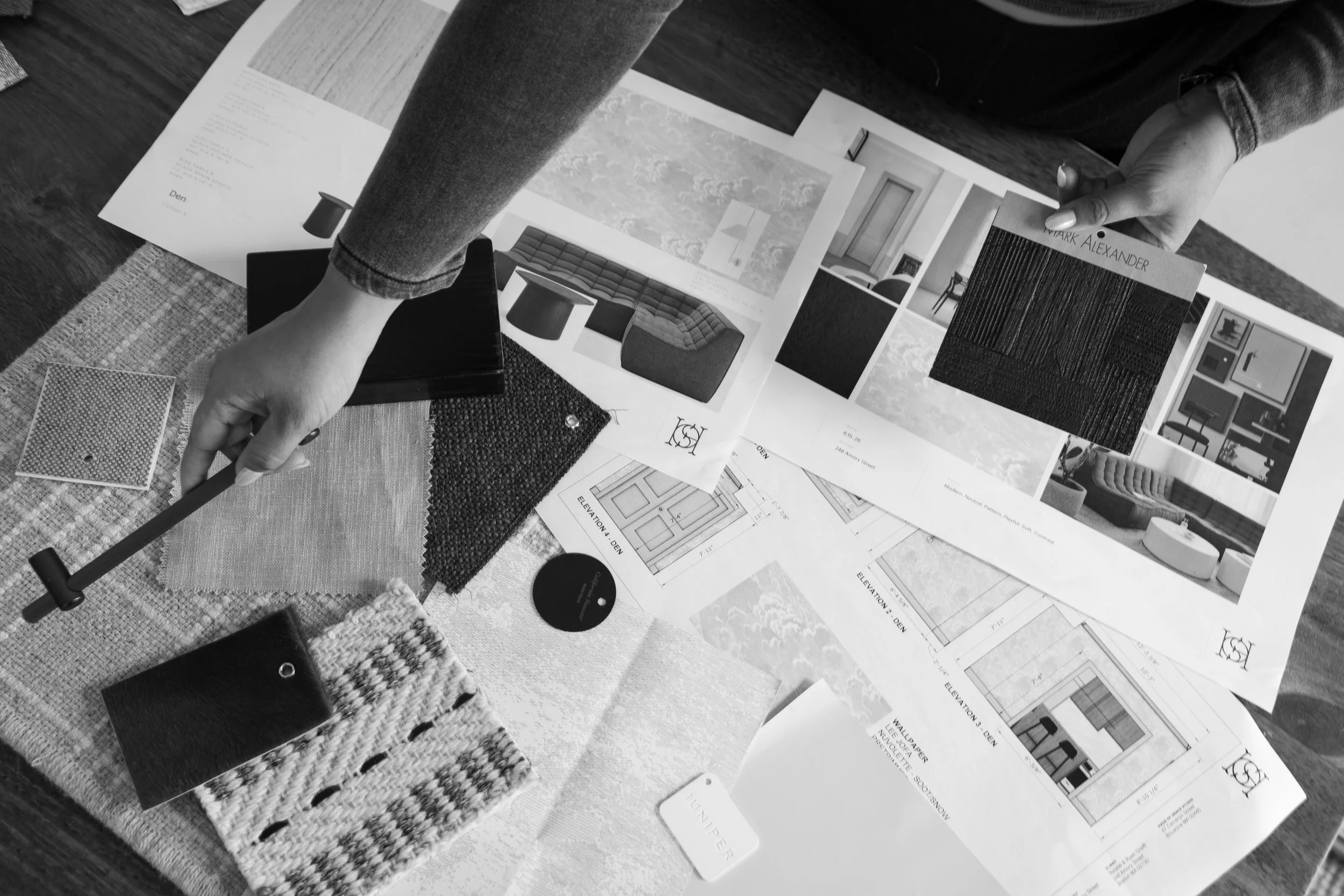 Laying out bespoke material palettes, color swatches, and floor plans for high-end Boston interior design.