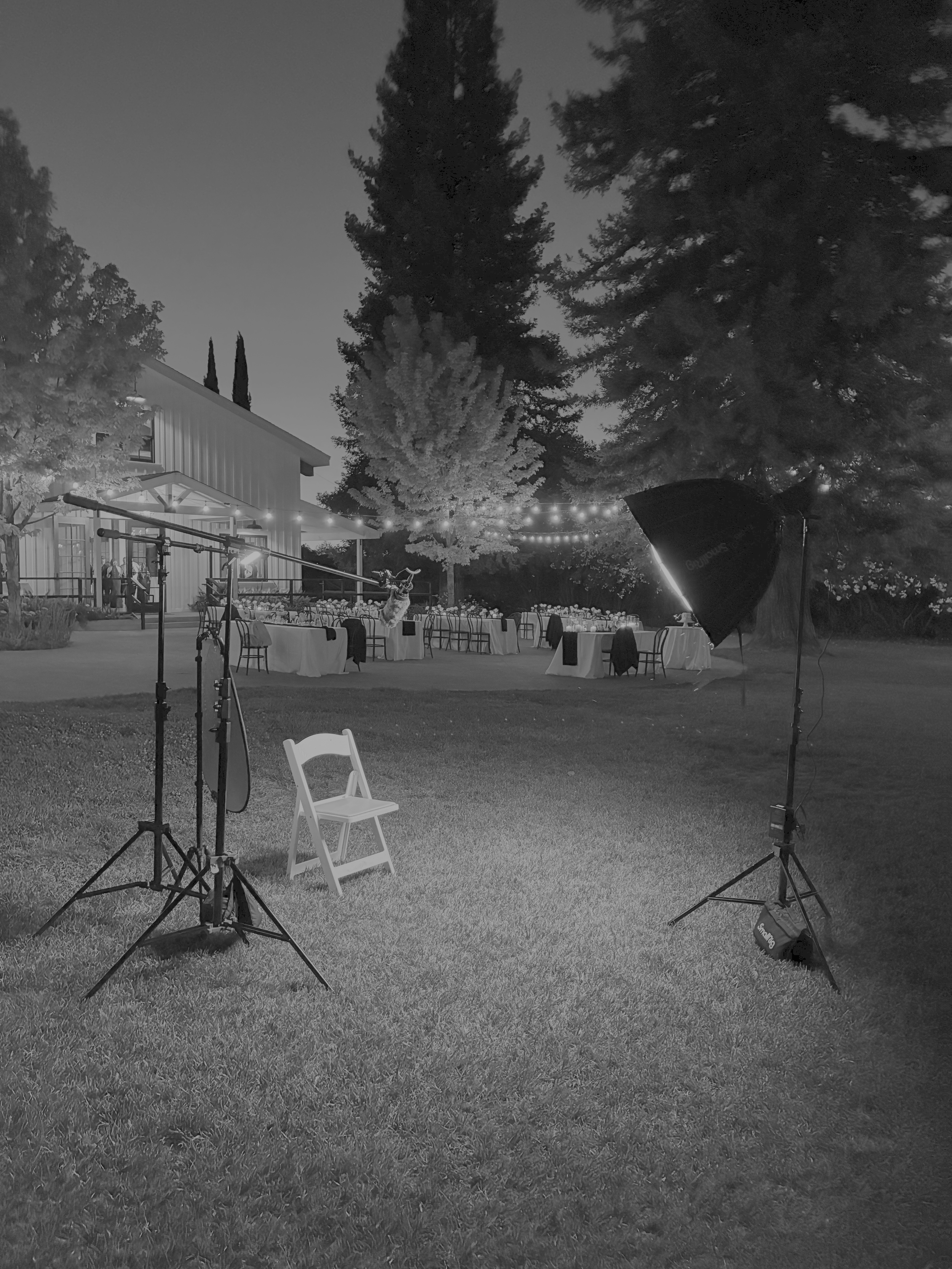 Cinematic wedding guest interview area with softbox lighting and boom microphone at Northern California outdoor wedding reception