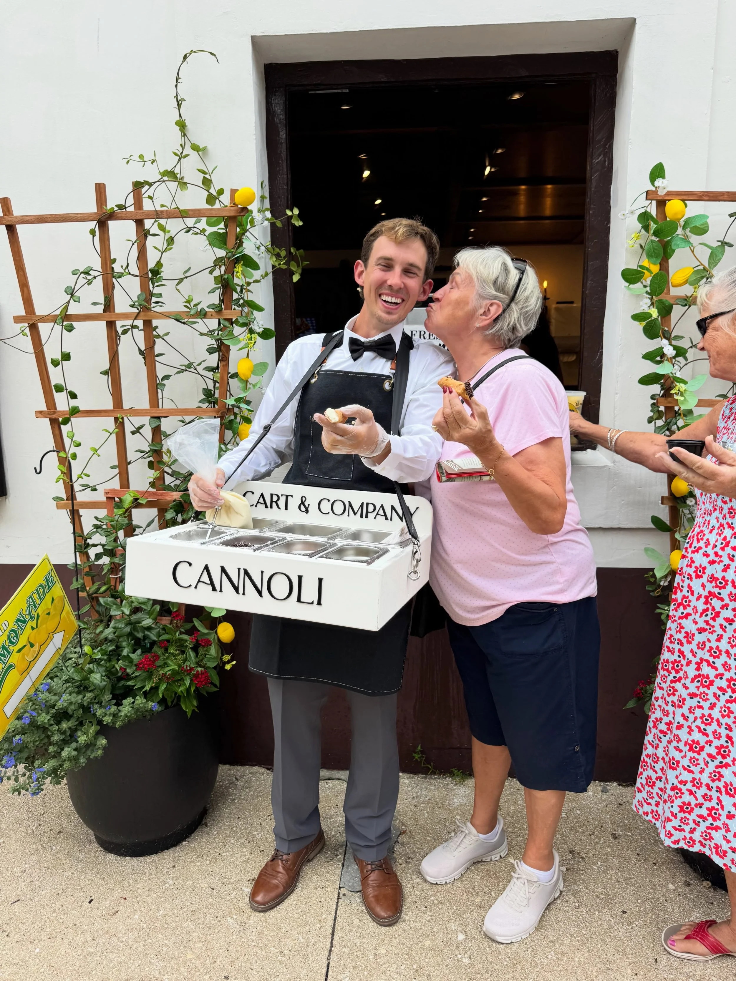 Meet Cam 🤵🏼👋🏽

One of the charismatic faces behind The Roaming Cannoli!

Cam is genuine, a little goofy, and ALWAYS ready to make your guests smile while they build their perfect cannoli. ✨

Because when you book The Roaming Cannoli, you&rsquo;re