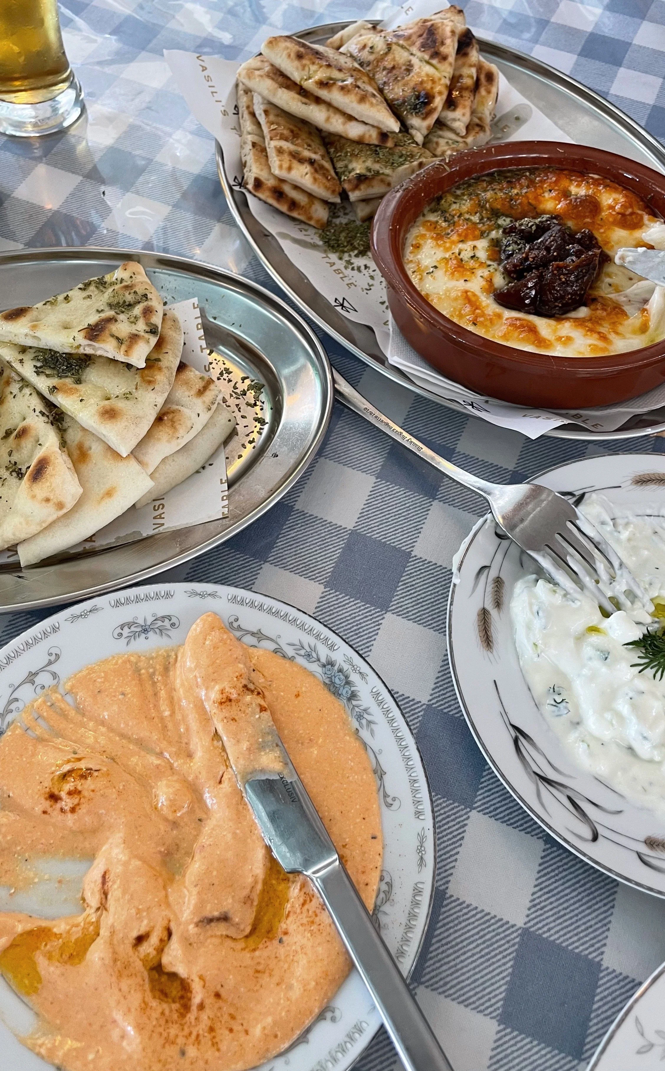 Tirokefteri and tzatziki with house-made pita bread and saganaki