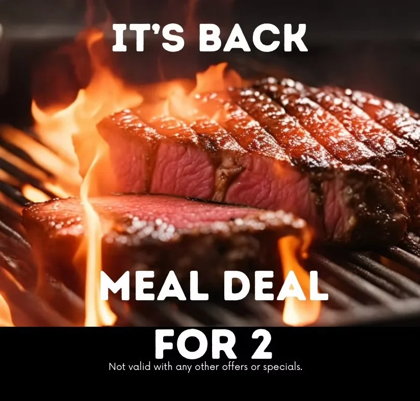 A close-up of a juicy grilled steak with grill marks being cooked on a barbecue grill with flames. The text overlay reads: 'IT'S BACK MEAL DEAL FOR 2. Not valid with any other offers or specials.'