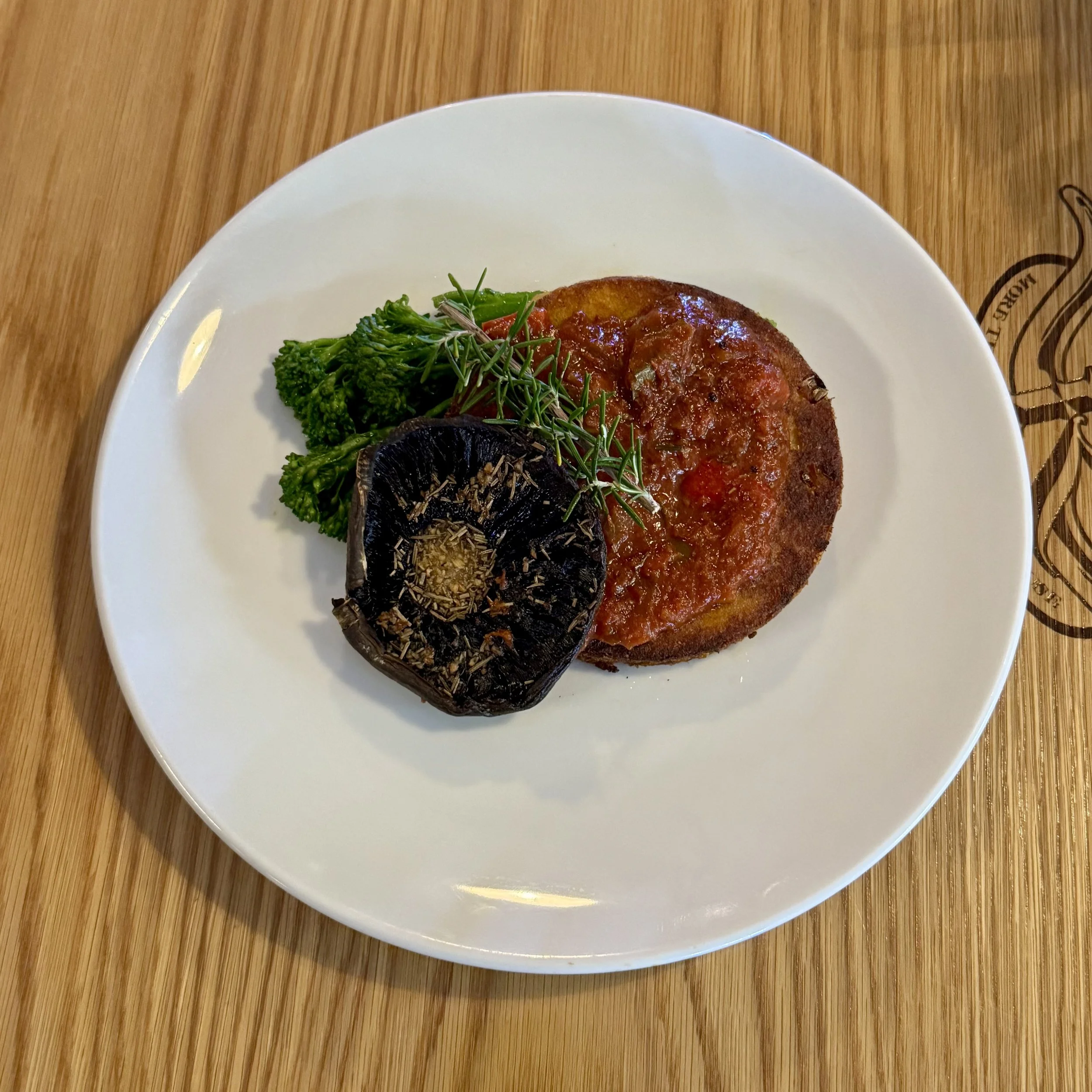 Leek & Potato cake with local greens, tomato salsa and roasted mushroom