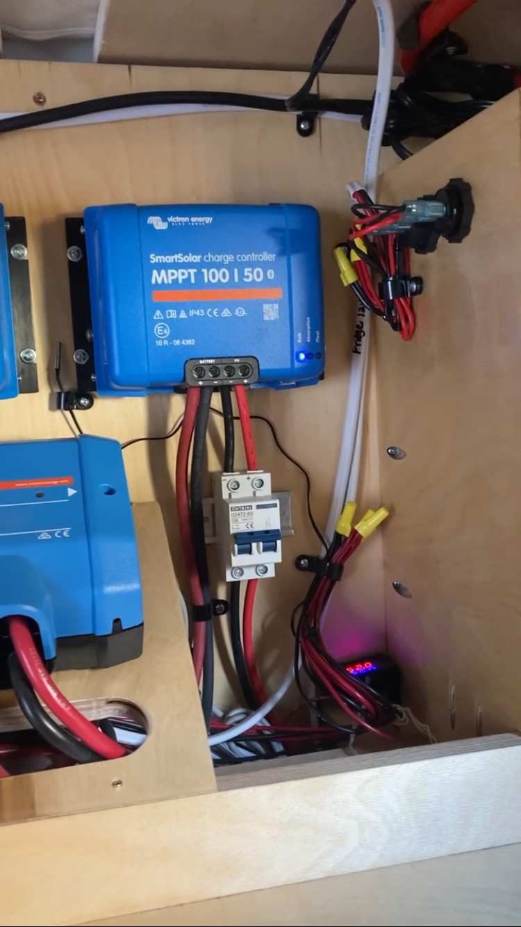 Victron MPPT 100/50 Solar charger and disconnect. Also to the left of the solar disconnect there is a temperature sensor that controls two ventilation fans at each end of the electrical layout to keep the sytem cool