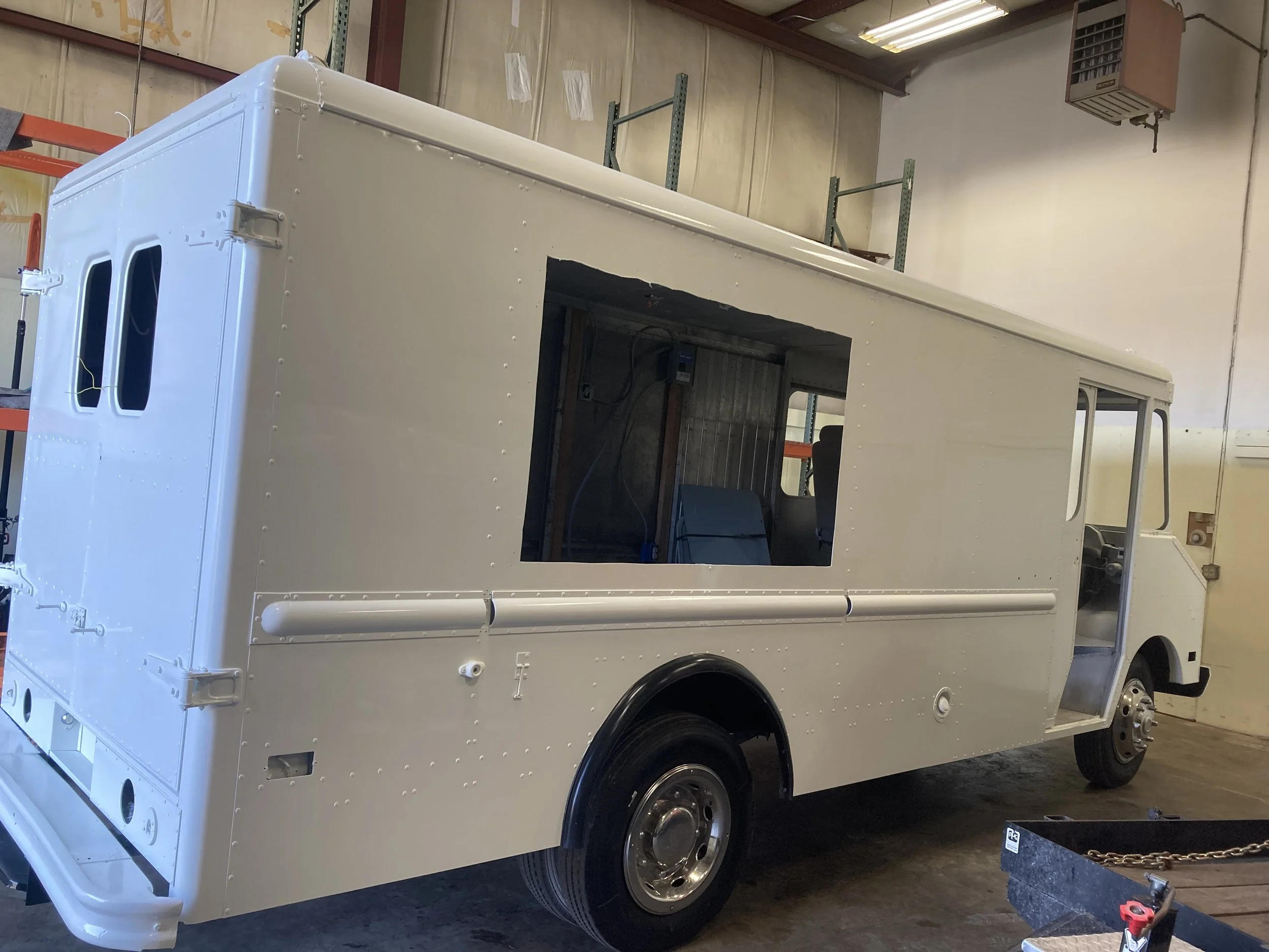 There was already a serving window due to it already being an ice cream truck. But we cleaned that up in order to fit in a new one