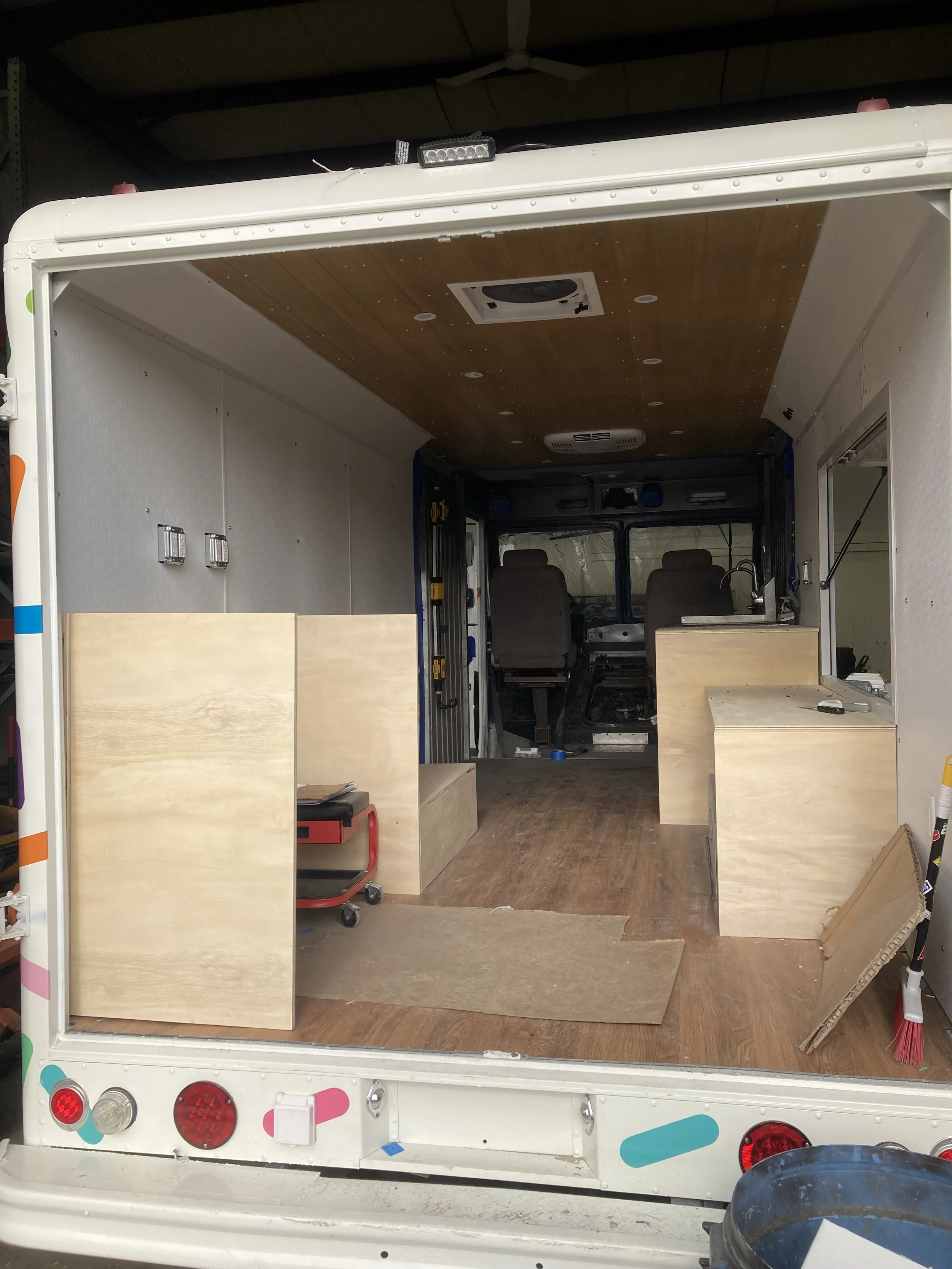 Built simple economical cabinetry that is later wrapped in white 1/16" brake metal for food truck regulations
