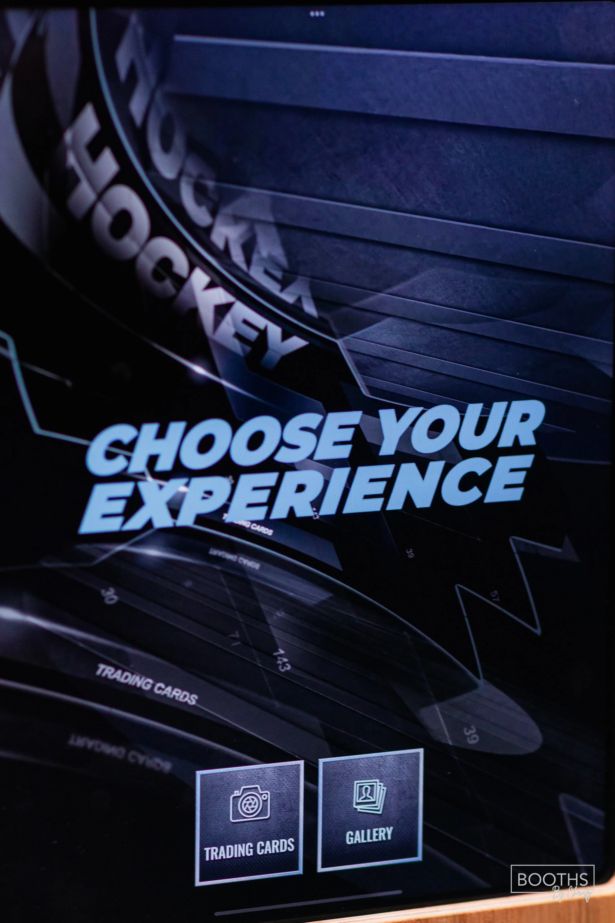 Screen with the text "Choose Your Experience" and two icons labeled "Trading Cards" and "Gallery" on a dark background.