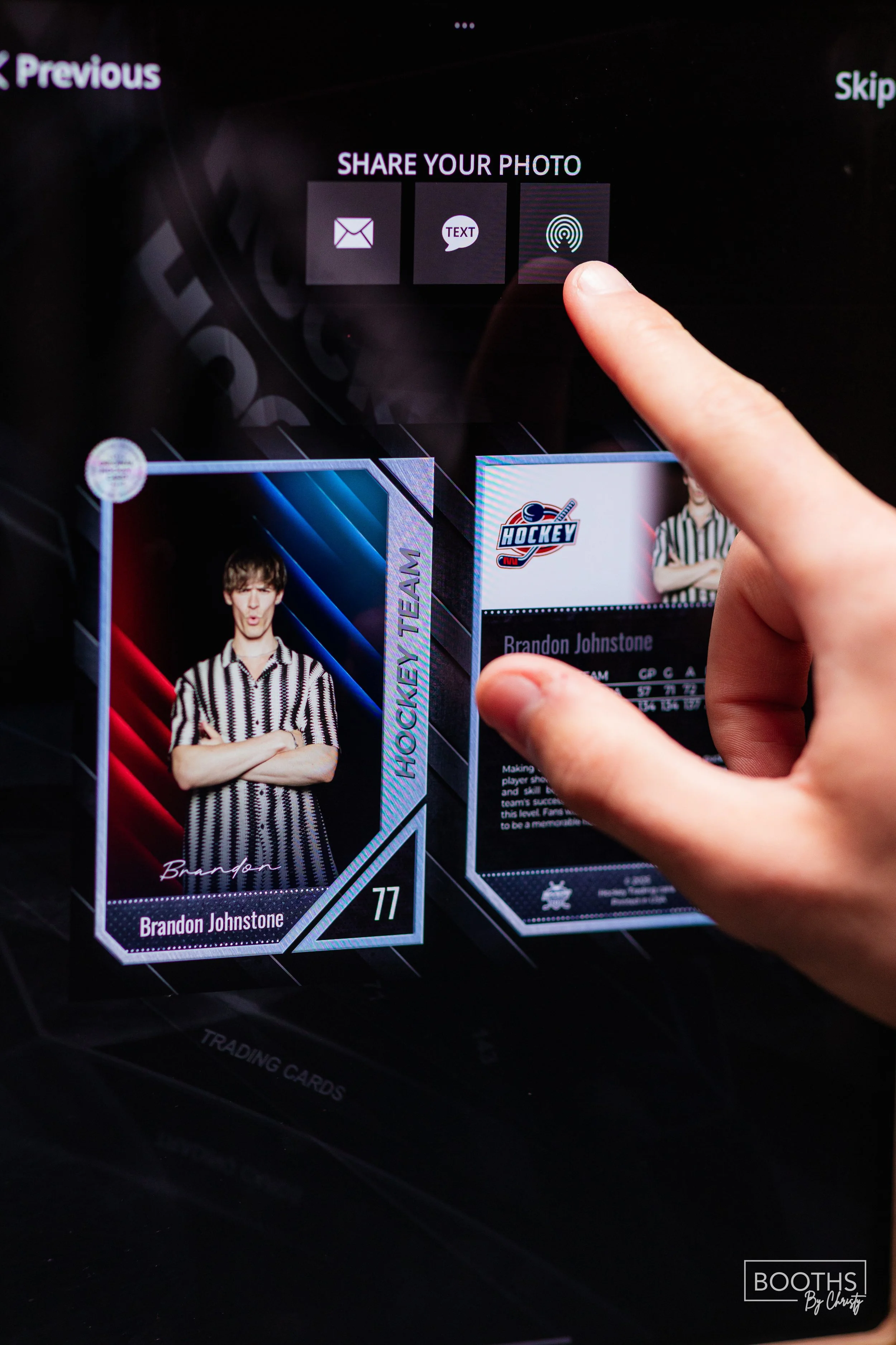 A person selecting a digital hockey trading card of Brandon Johnstone on a touchscreen device, with sharing options displayed above.