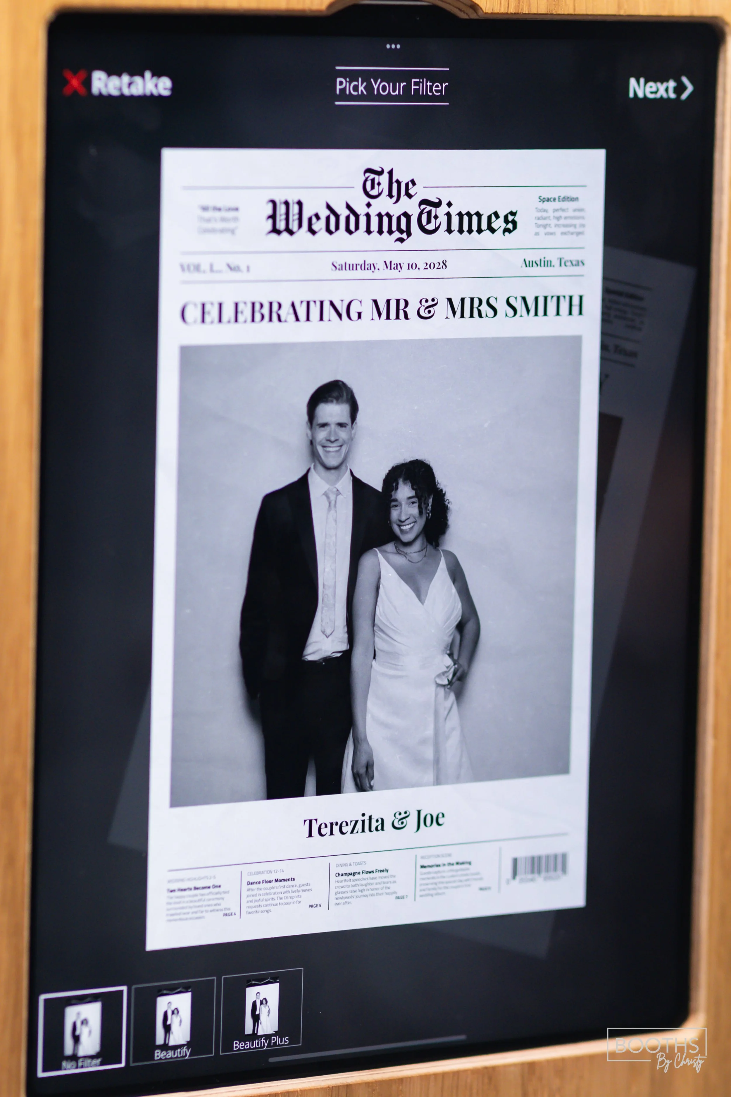 A digital screen displaying a black-and-white photo of a wedding couple, with a newspaper-style header titled "The Wedding Times" and text celebrating Mr. and Mrs. Smith. The bride and groom are smiling, standing side by side, with the bride holding