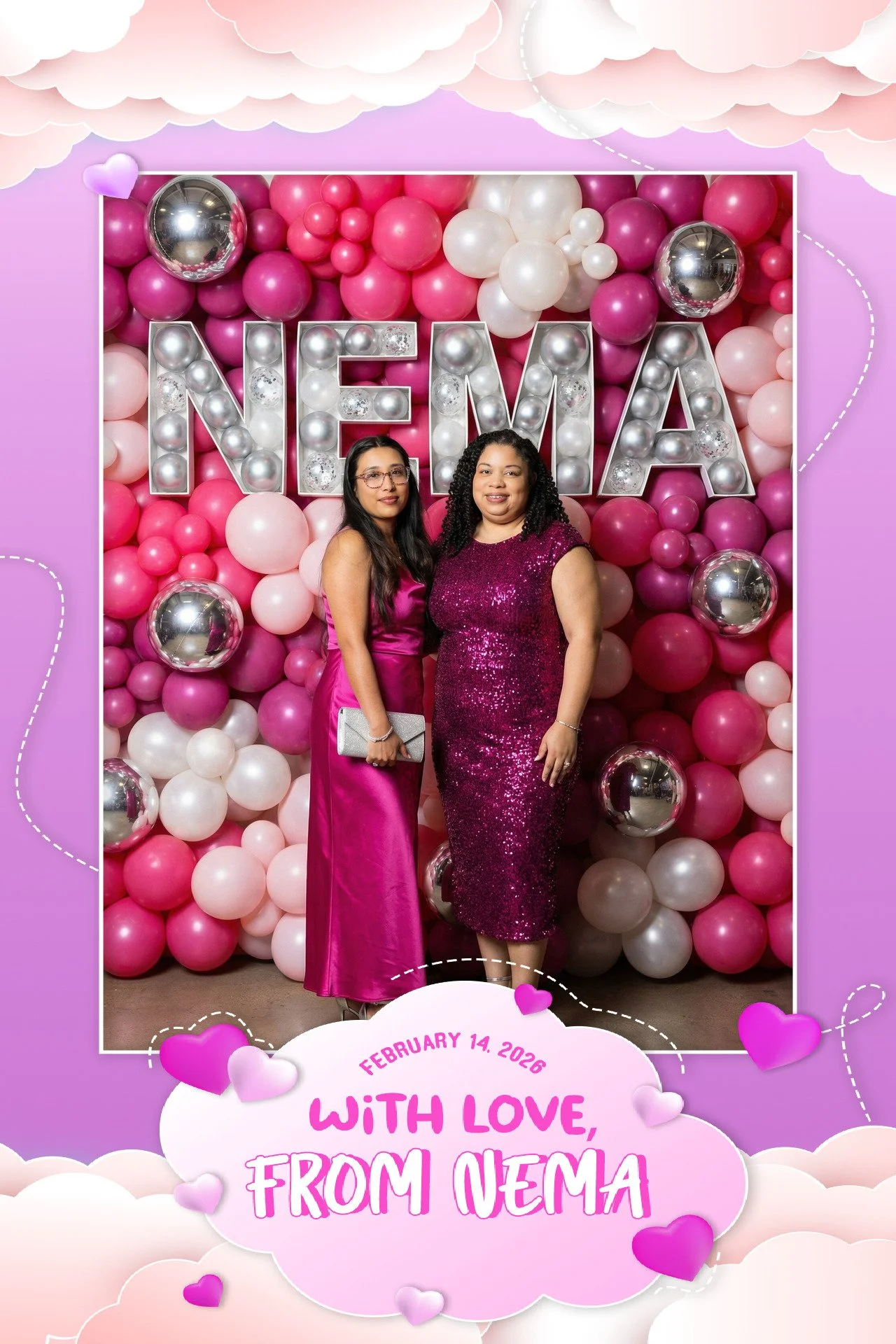 Two women in pink dresses stand in front of a pink, white, and silver balloons backdrop with the large letters 'NEMA' lit up in front. There is a date and message on a pink and white cloud-shaped sign at the bottom that reads, 'February 14, 2026, Wit