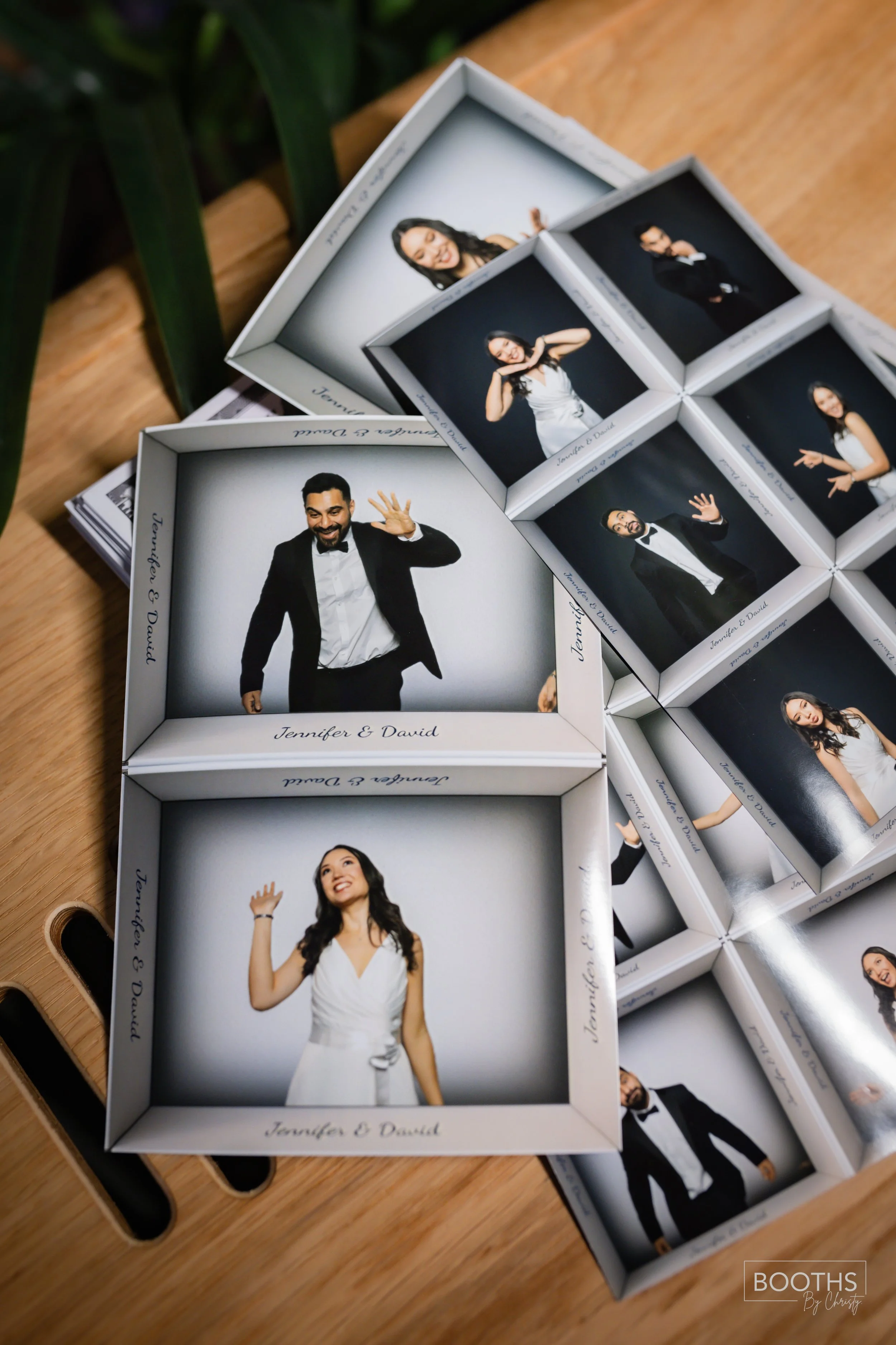 Photo booth strips with images of a man and woman in formal attire, celebrating a wedding. The borders of the strips are personalized with the names Jennifer and David.