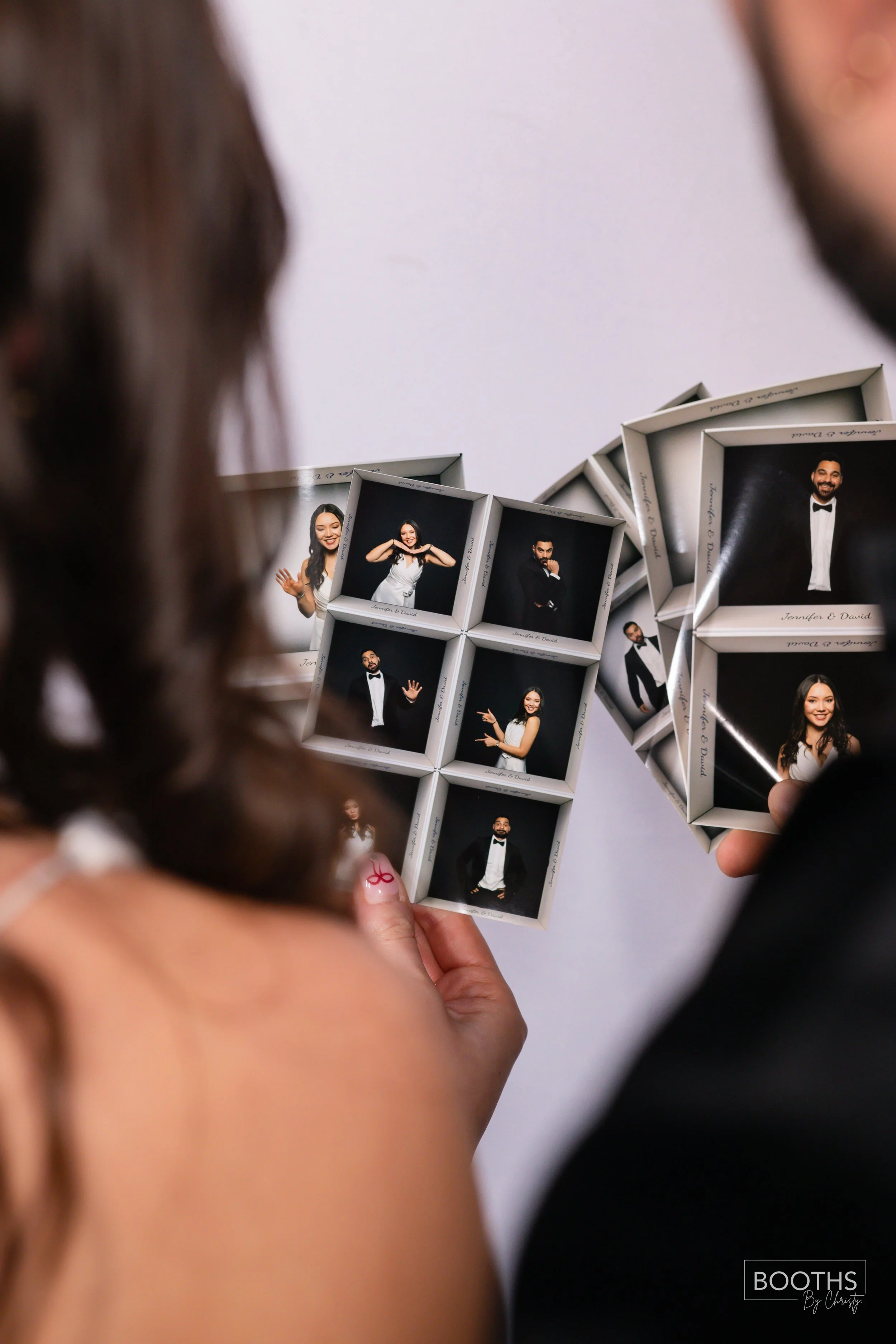People holding picture frames with photos of a man and woman dressed in formal attire, celebrating a special occasion.